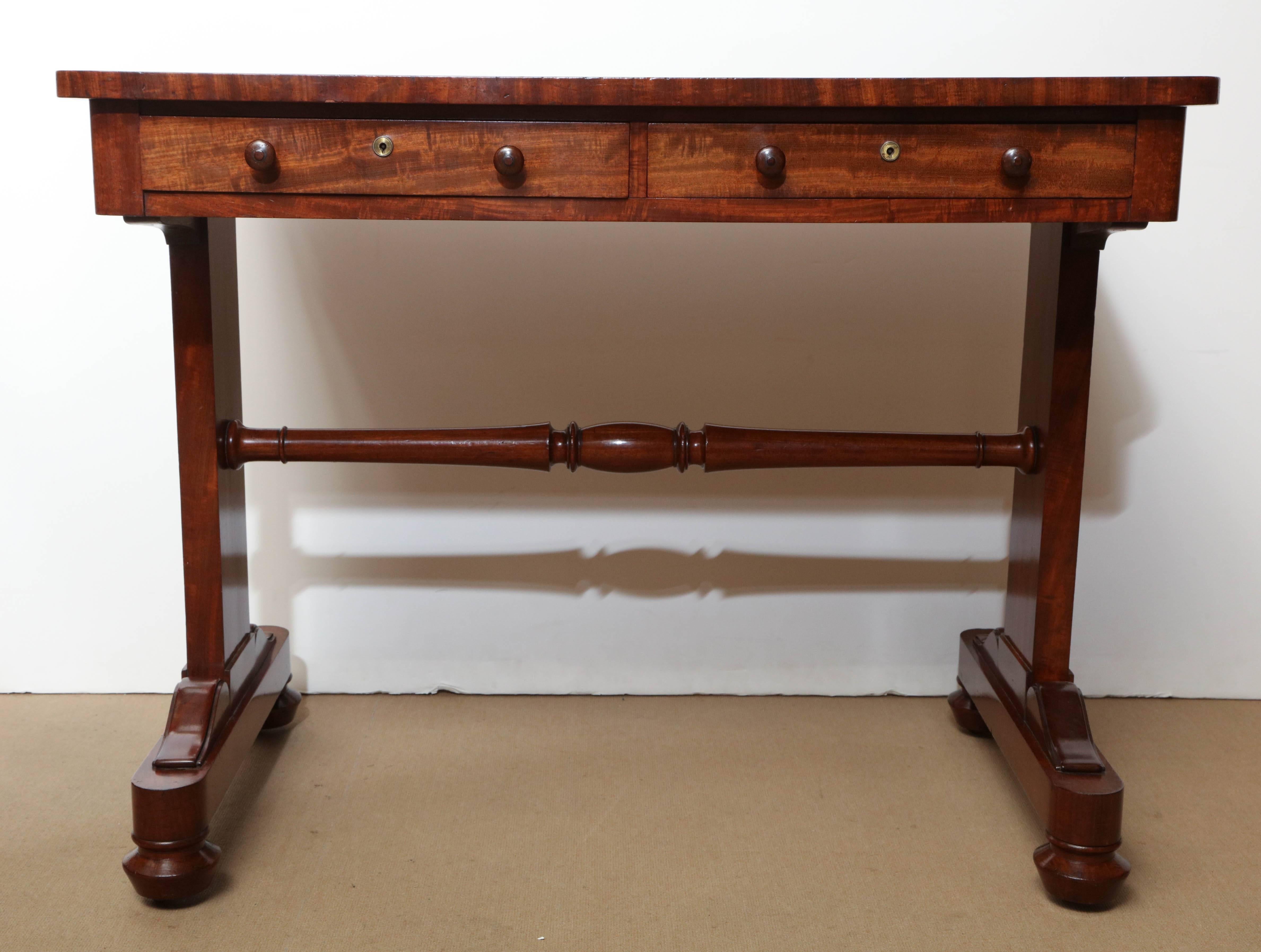Early 19th century English, mahogany and leather top desk by Gillows & Co.