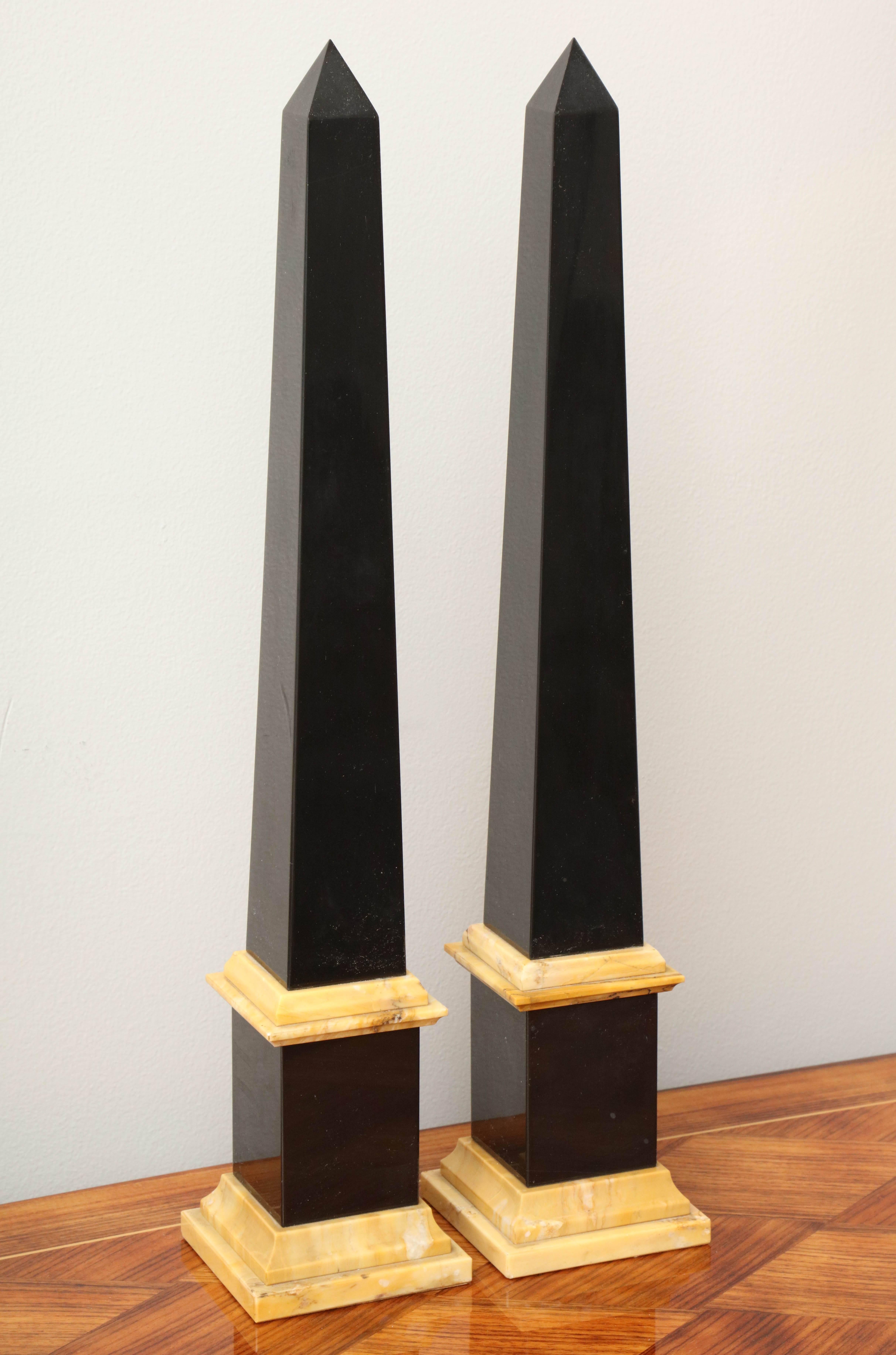 Grand black and Sienna marble obelisks. Pair available; priced and sold individually.