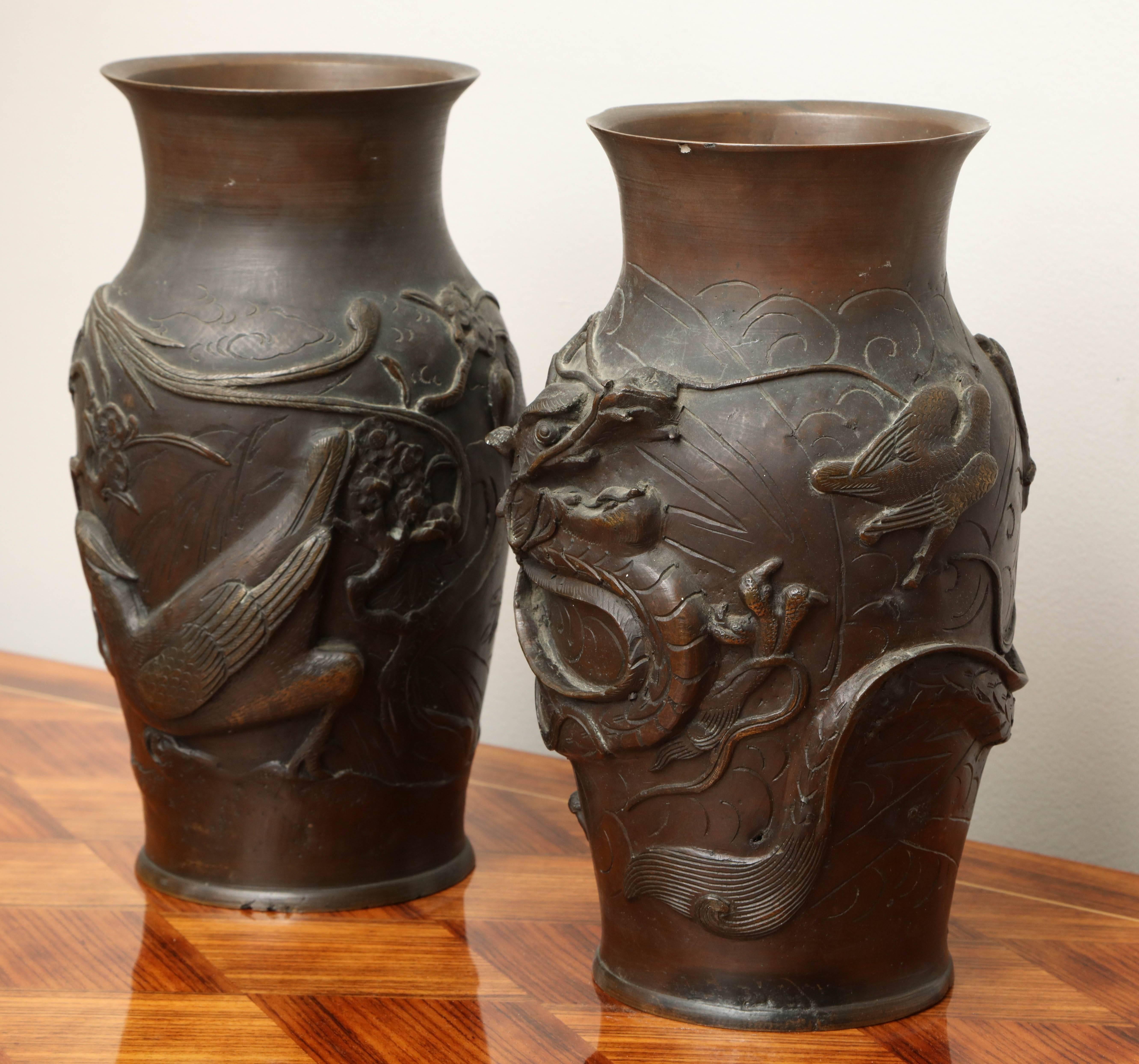 Bronze Japanese urns from the late 19th century. Could be converted to table lamps. Pair available; priced and sold individually.