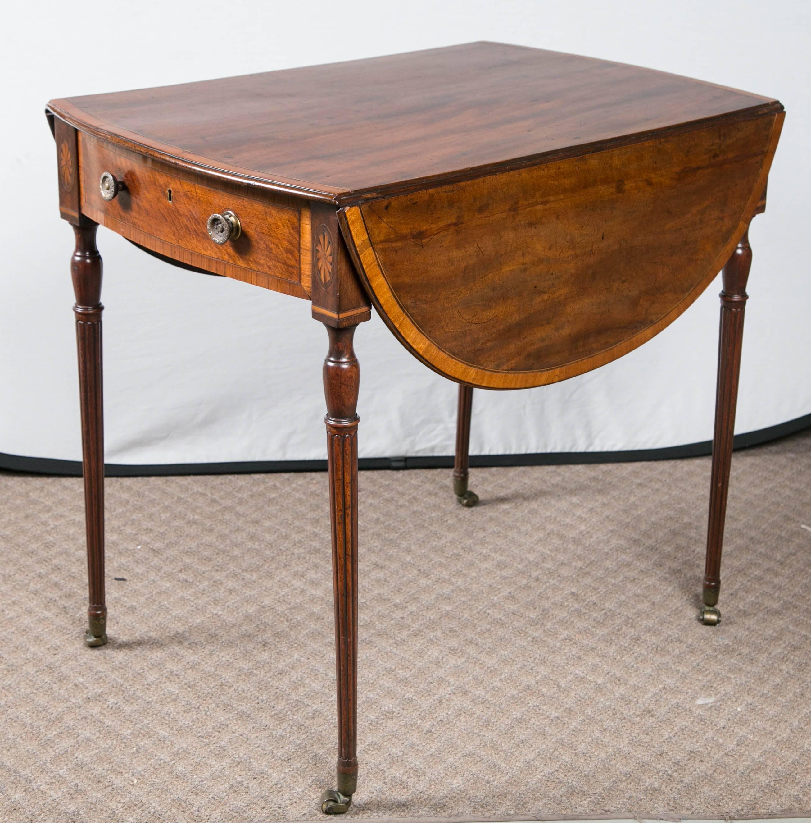 English Pembroke table on casters with satinwood banding, circa 1790-1805.