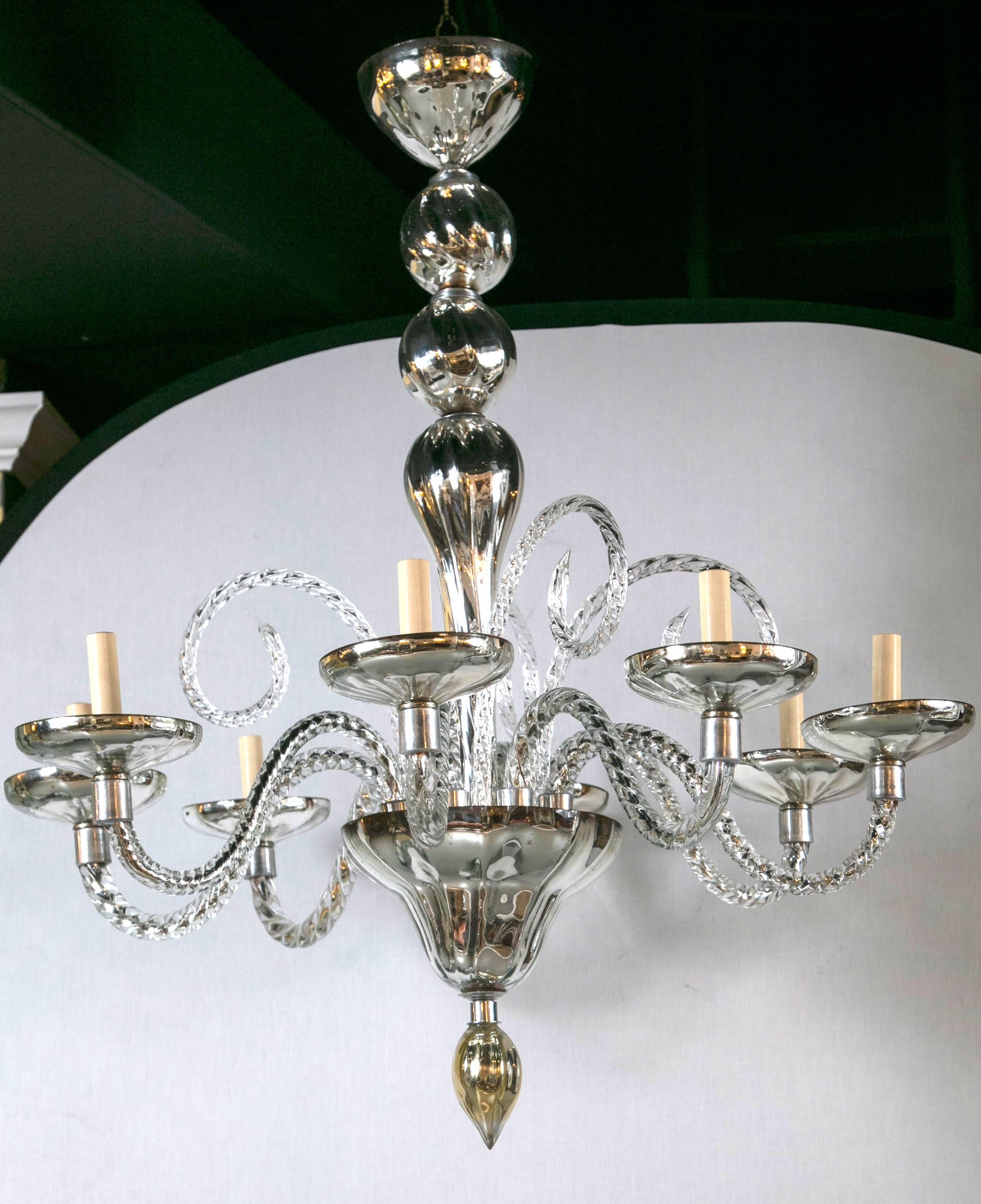 This pair of French mercury glass chandeliers boasts eight twisted glass arms, circa 1930s. Priced per piece.