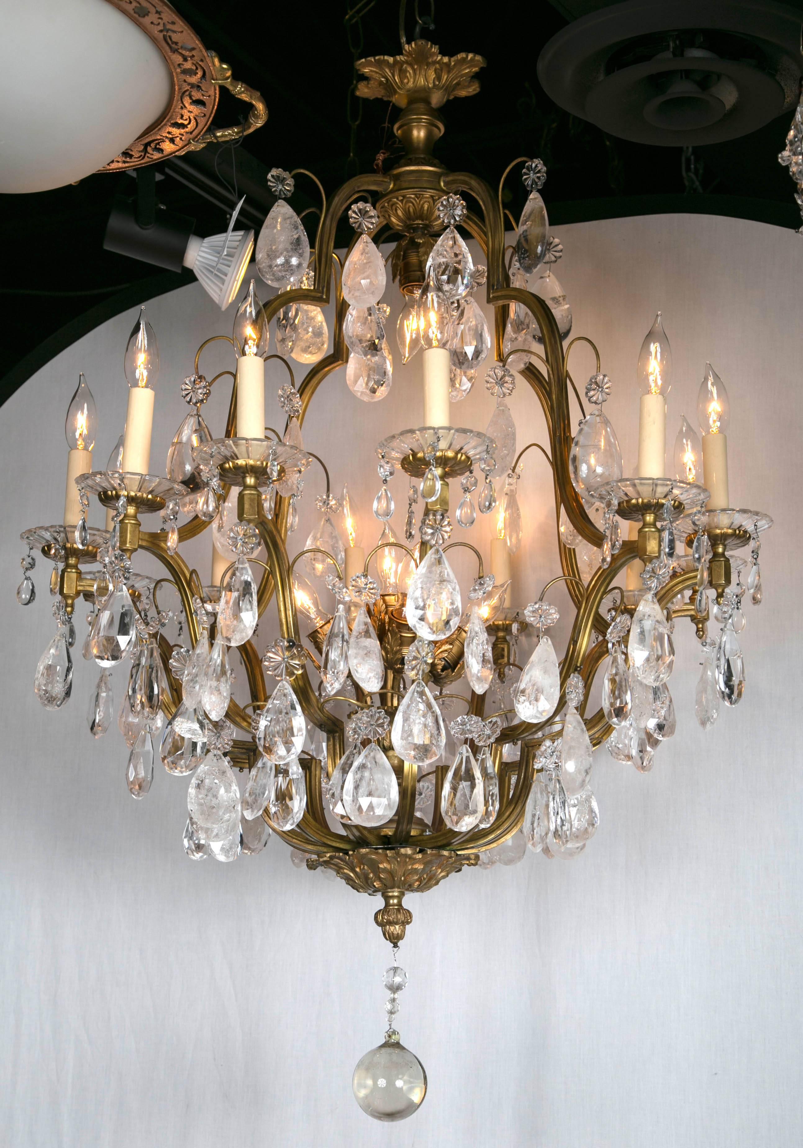 Beautiful French gilt bronze eighteen-light chandeliers with rock crystal pendants,
late 19th century, priced per piece.