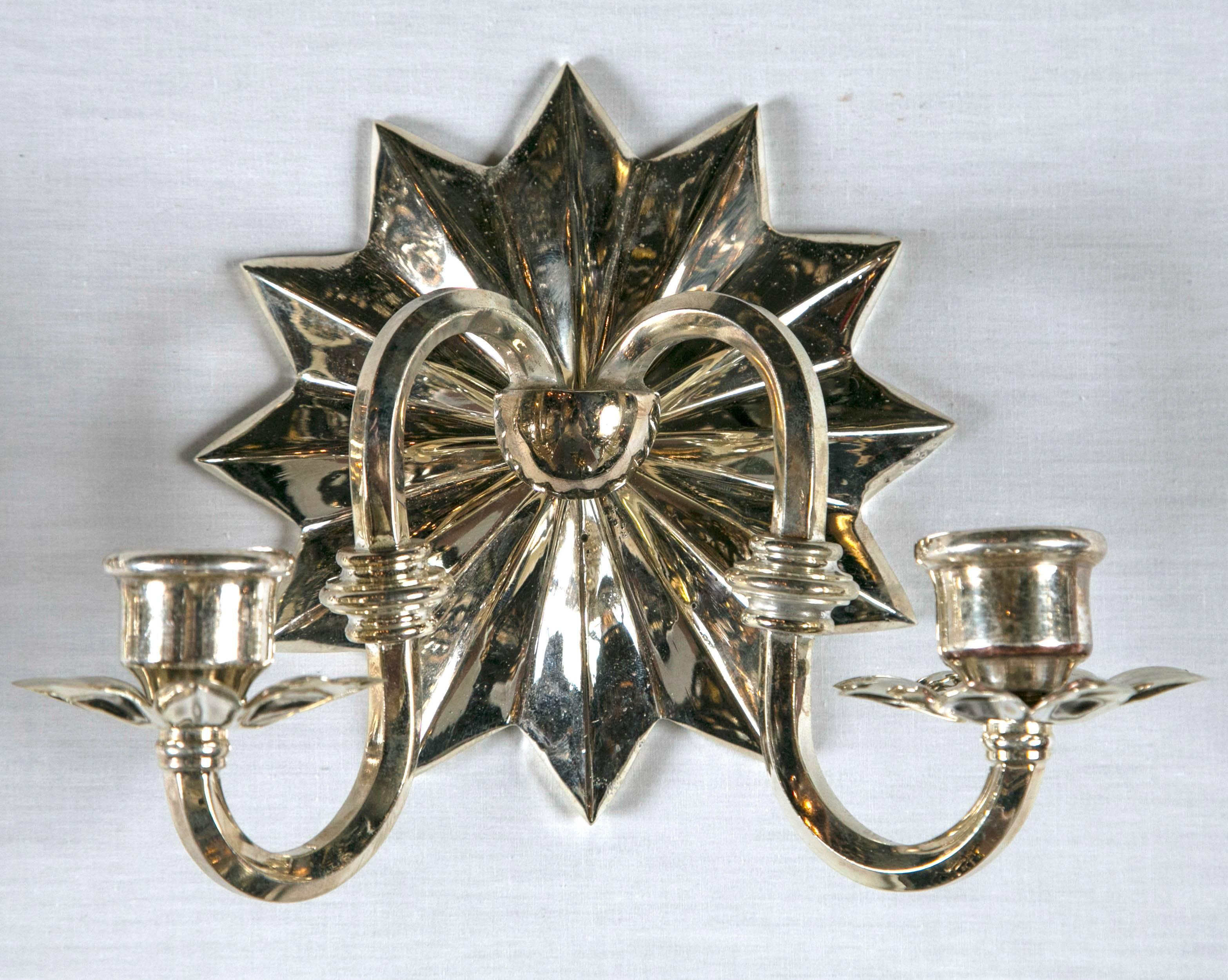 Caldwell silver plated sconces with starburst backplate, circa 1920s set of 12 available, priced per pair.