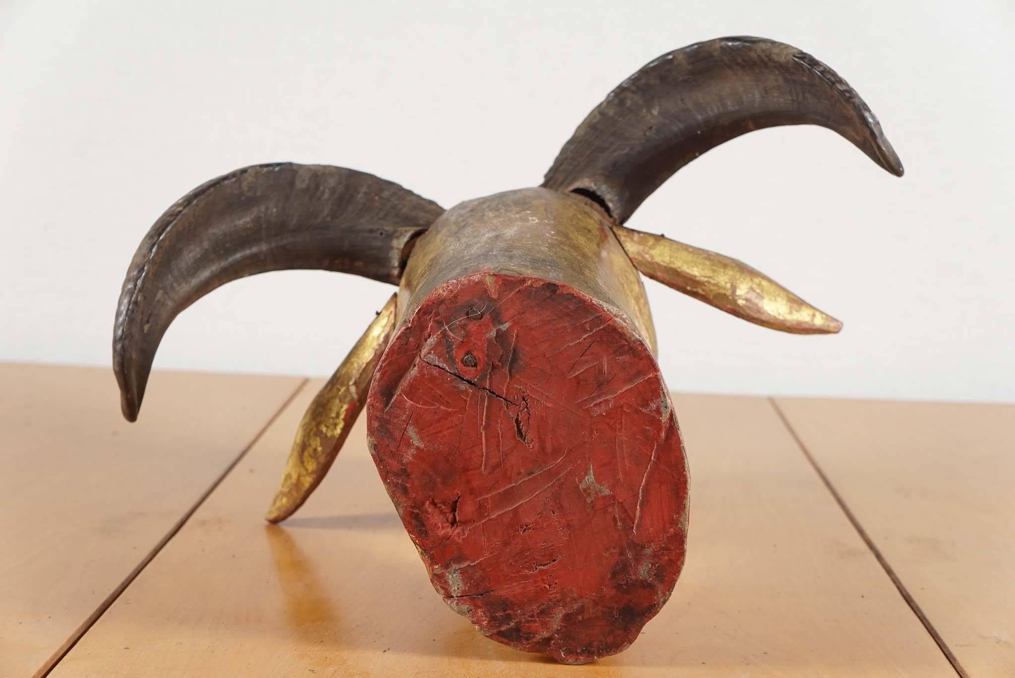 Early 20th Century Indonesian Carved Wood and Gold Washed Ram's Head, circa 1920