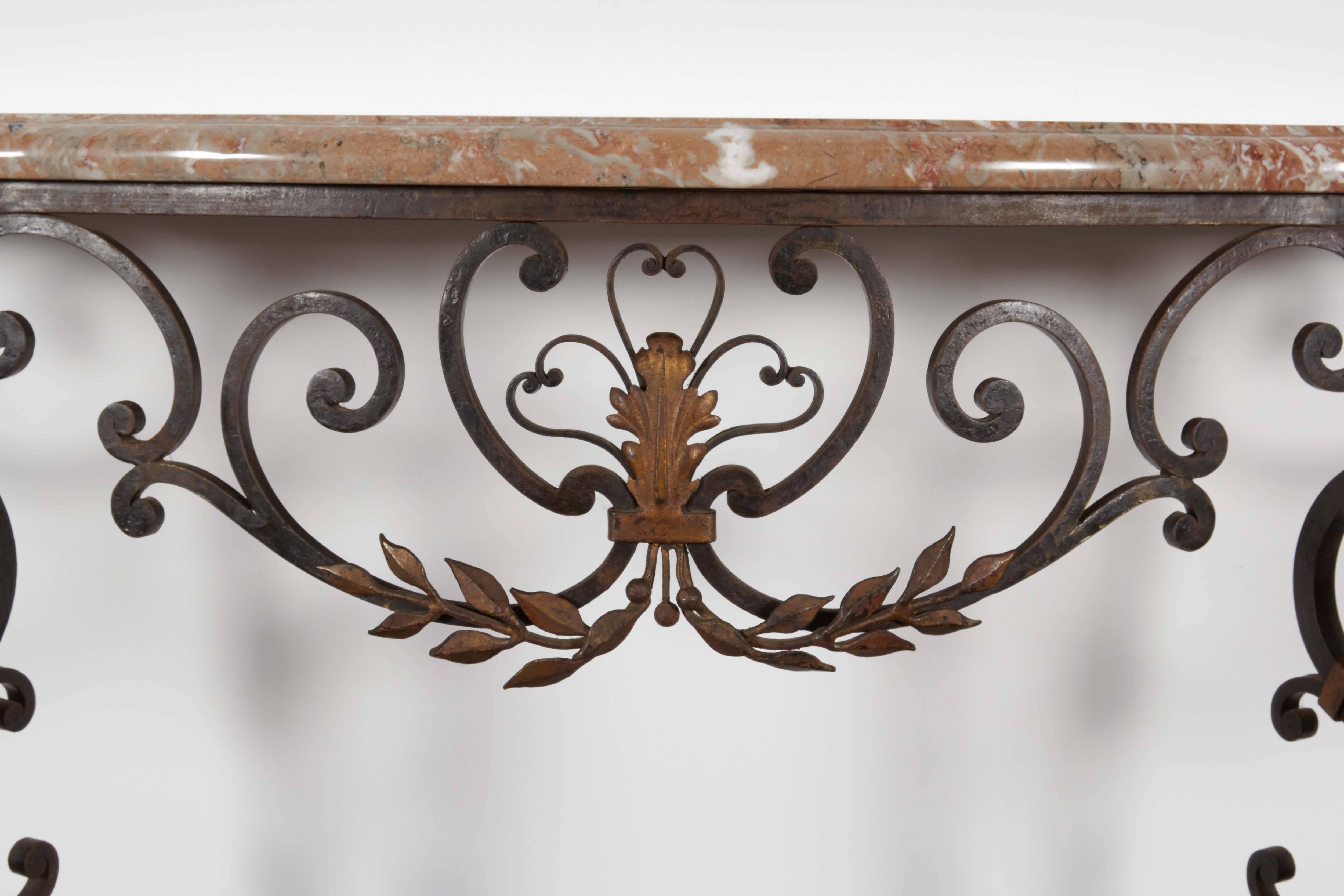 Marble top with wrought iron base demilune console.

 Not available for sale or to ship in the state of California.