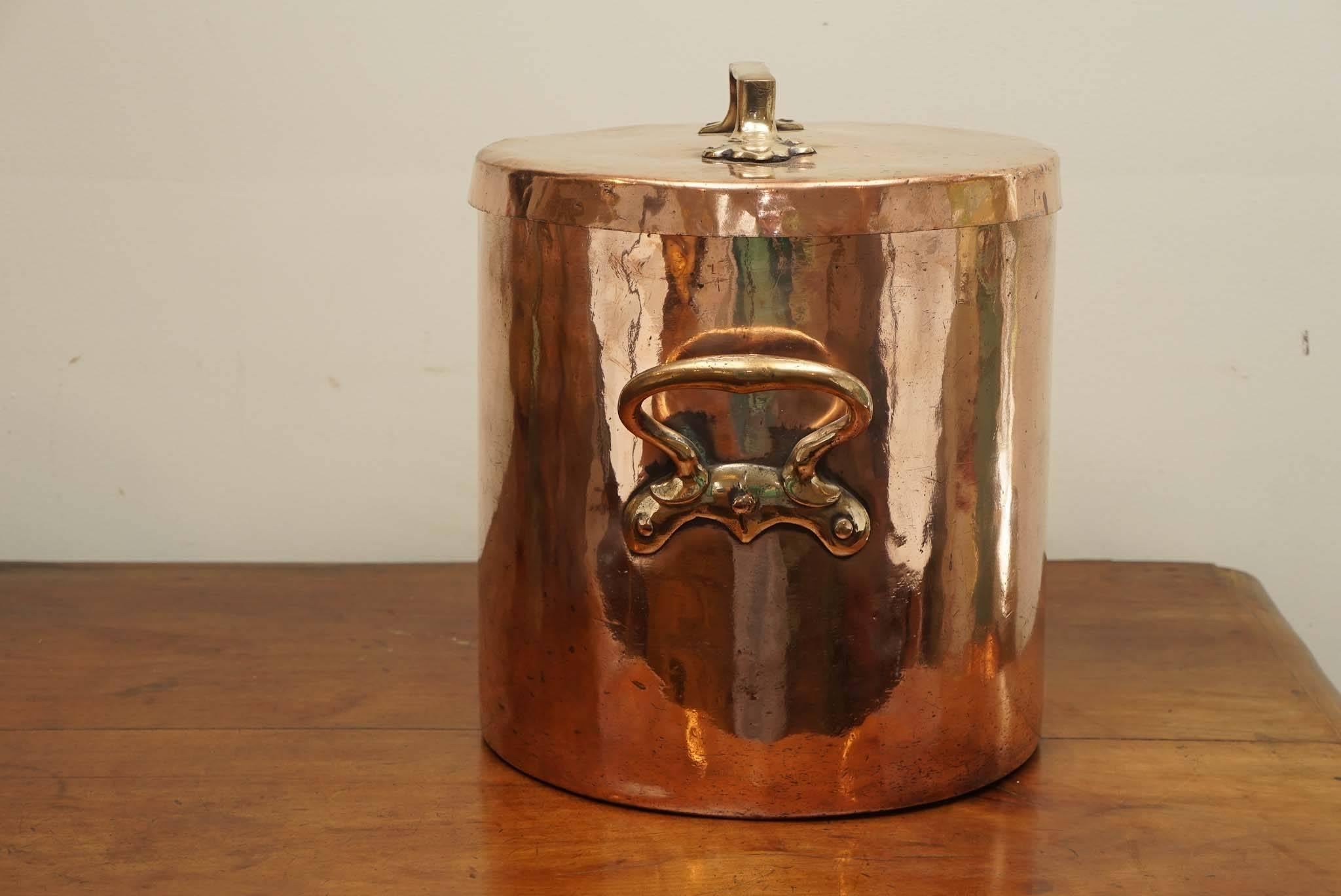 This is part of a larger collection of English and French copper at painted porch. Appropriately worn and polished to perfect condition for its age, this copper pot would make a wonderful display item in your kitchen, let alone the storage