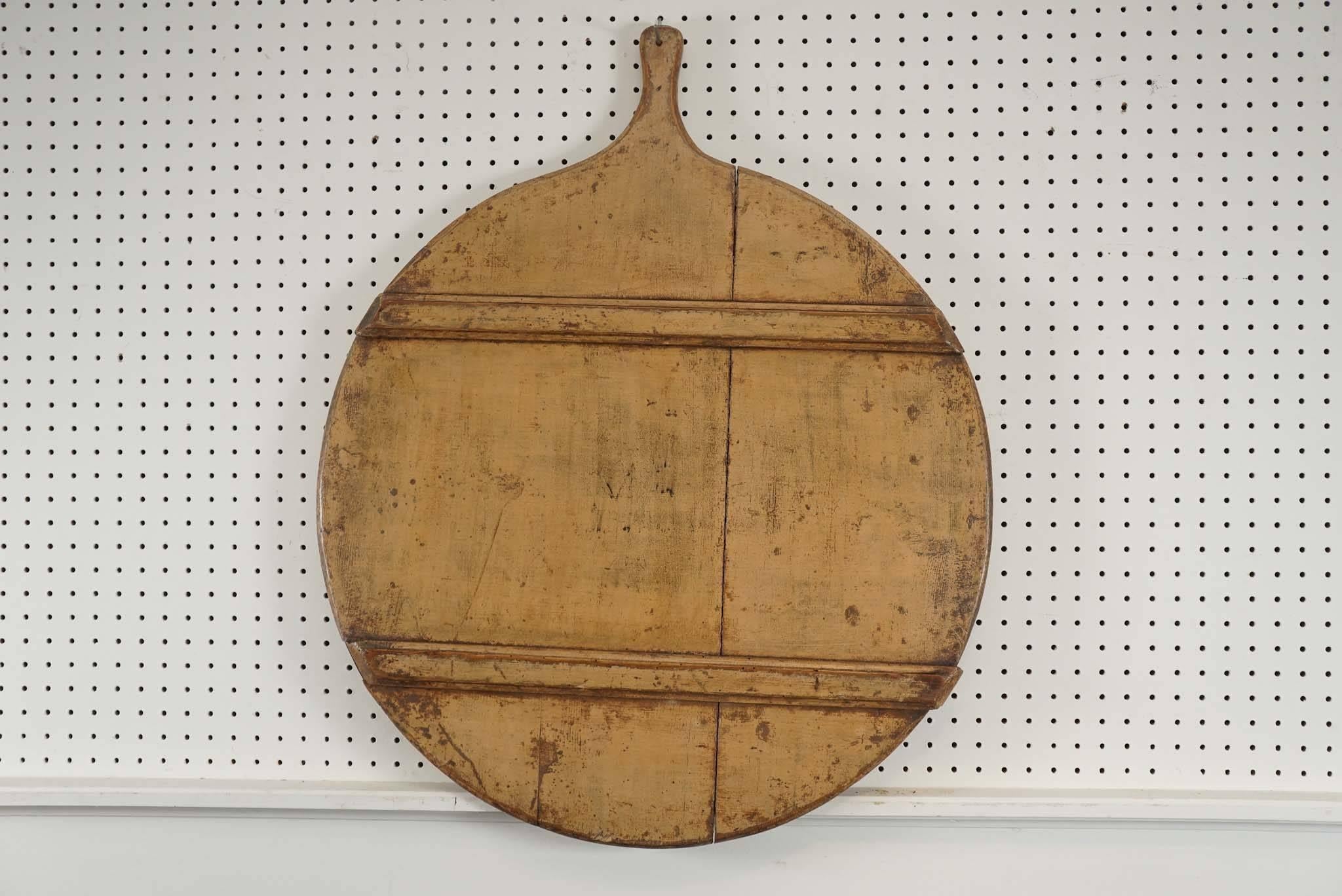 These boards were used to peel potatoes. The runners you see showing actually was the bottom of the peel board but for display it looks more interesting with the runners showing. The other side is perfectly flat. The patina is wonderful and there