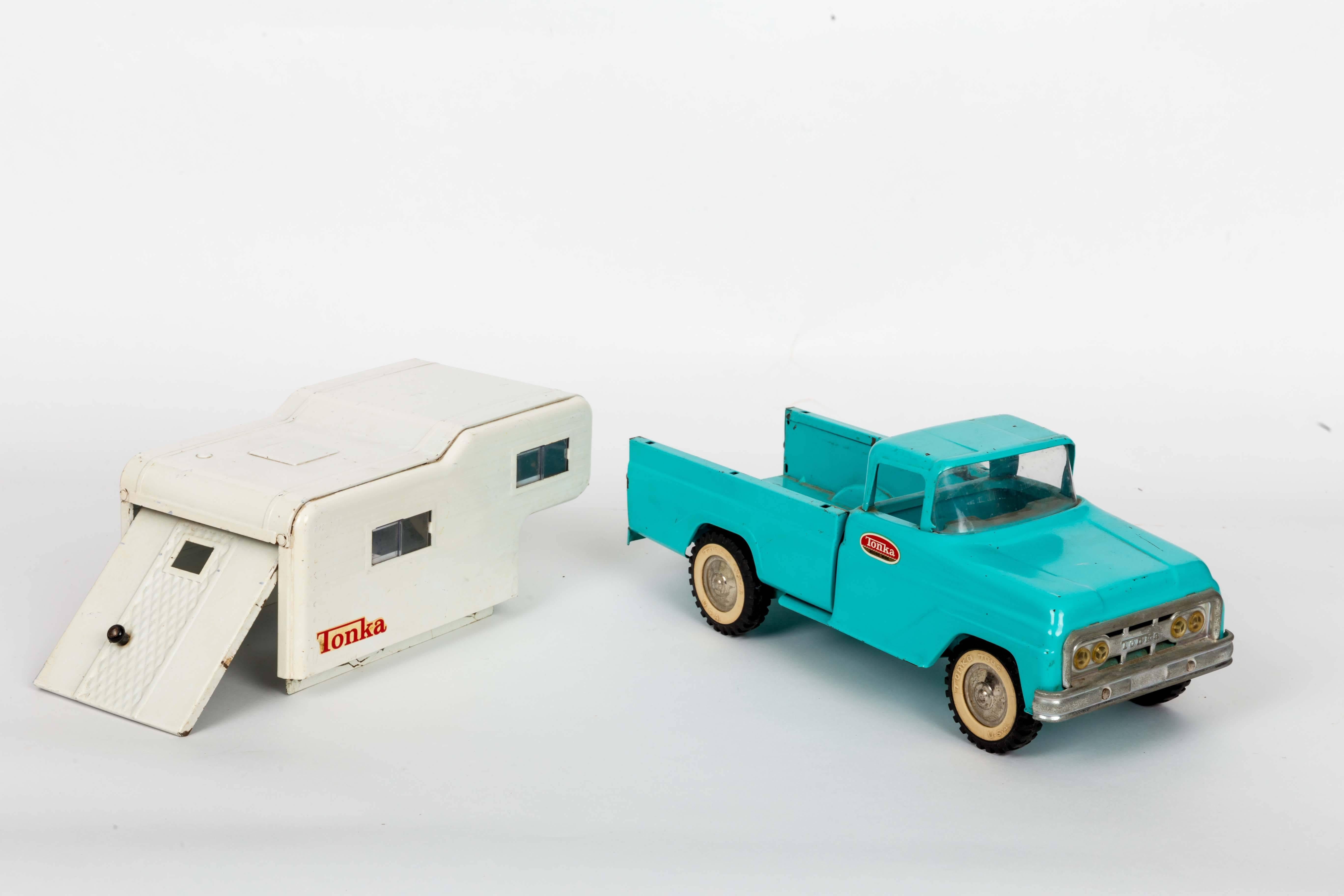 Blue 1963 toy Tonka trunk with white camper.