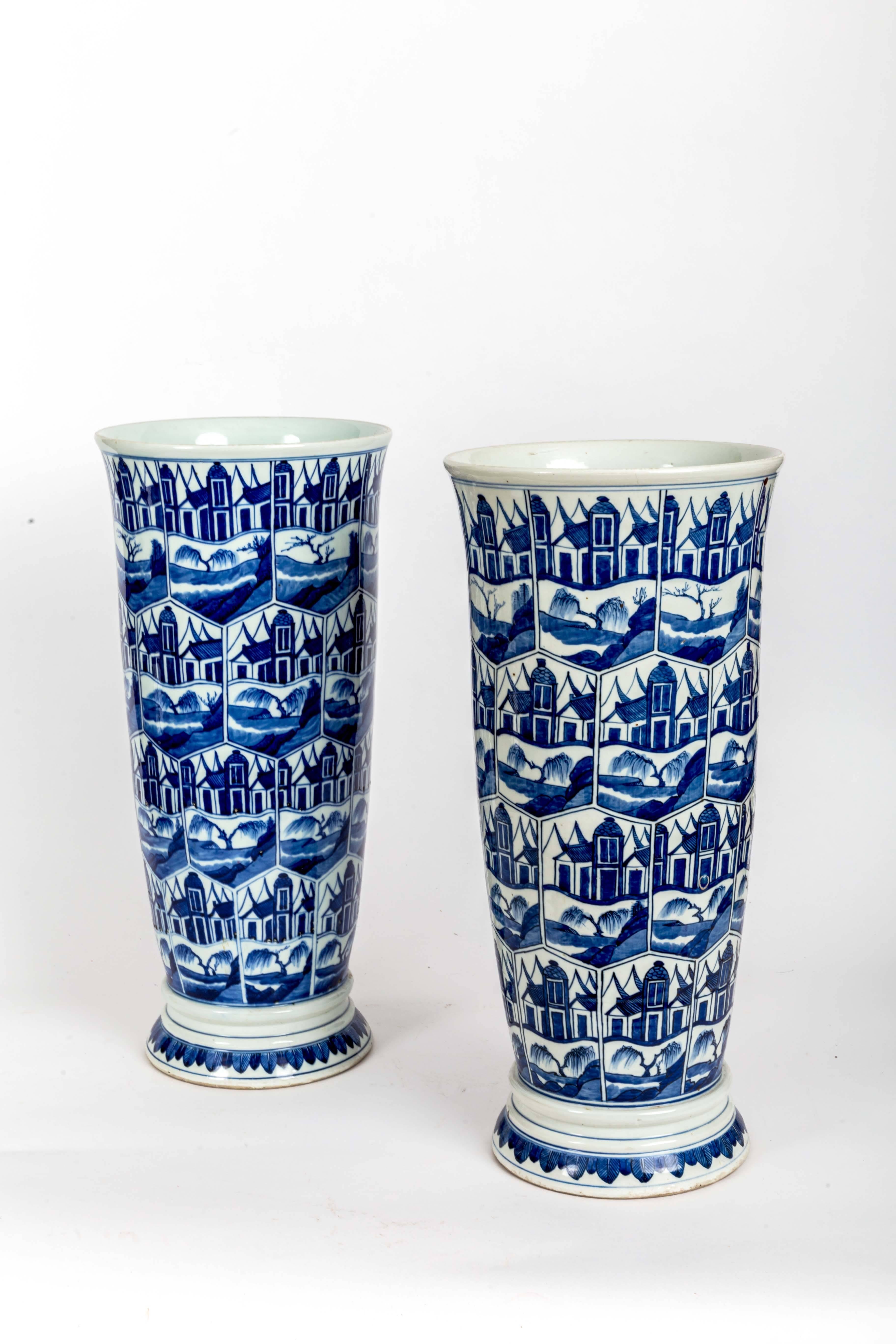 Pair of blue and white delft-style Chinese umbrella stand.