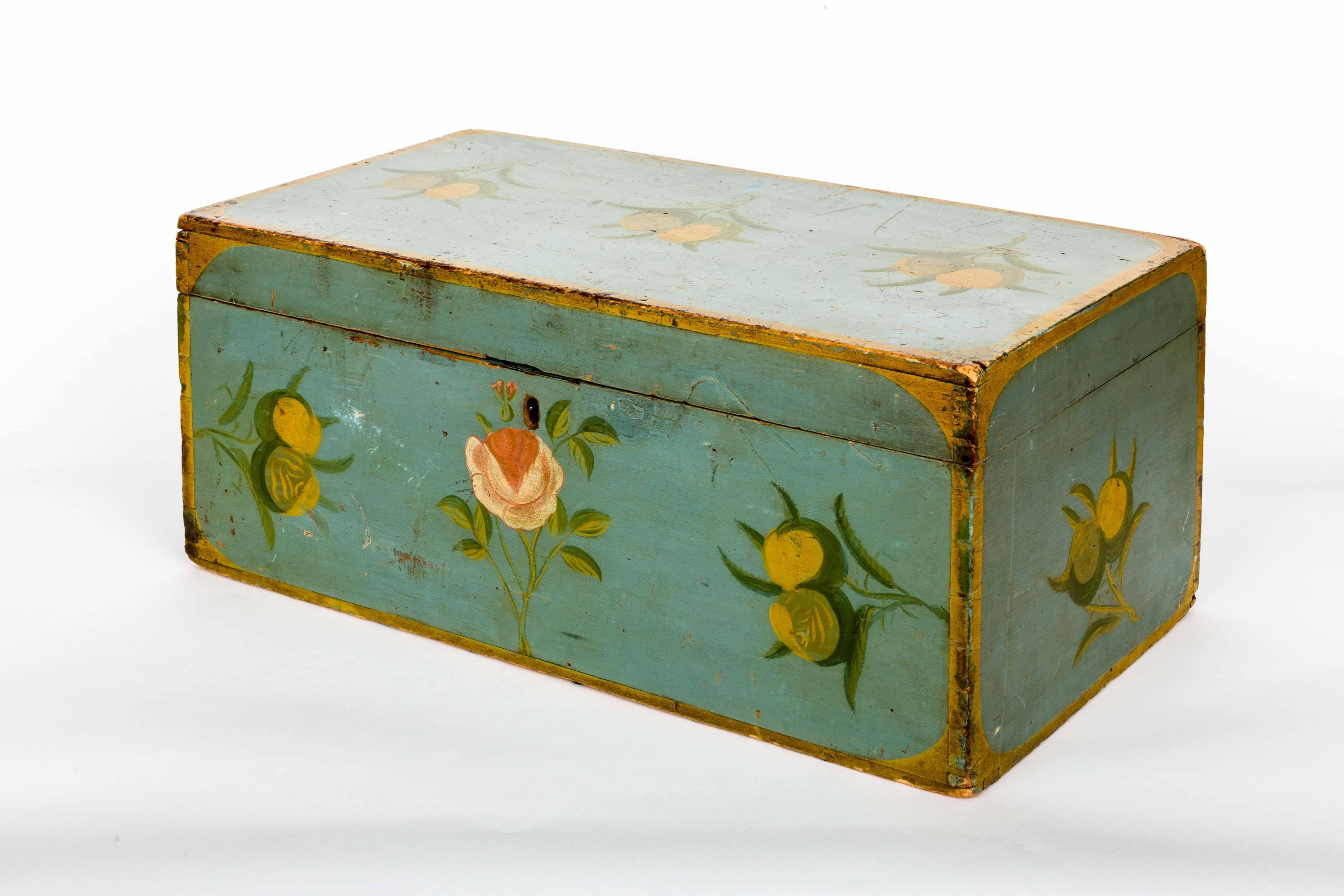 Painted American Folk Art box with floral motif and yellow trim.