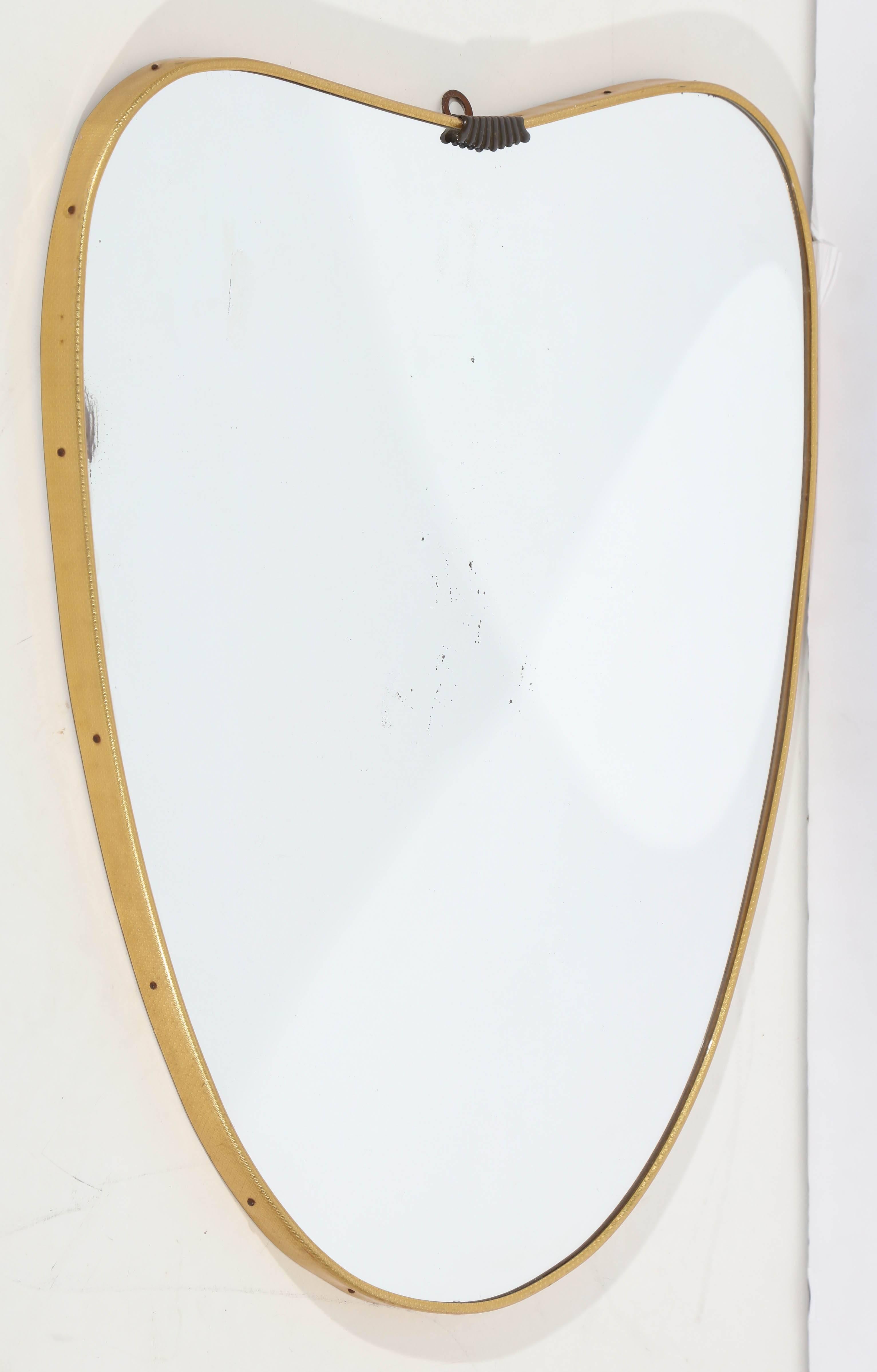 Italian mirror with brass frame.