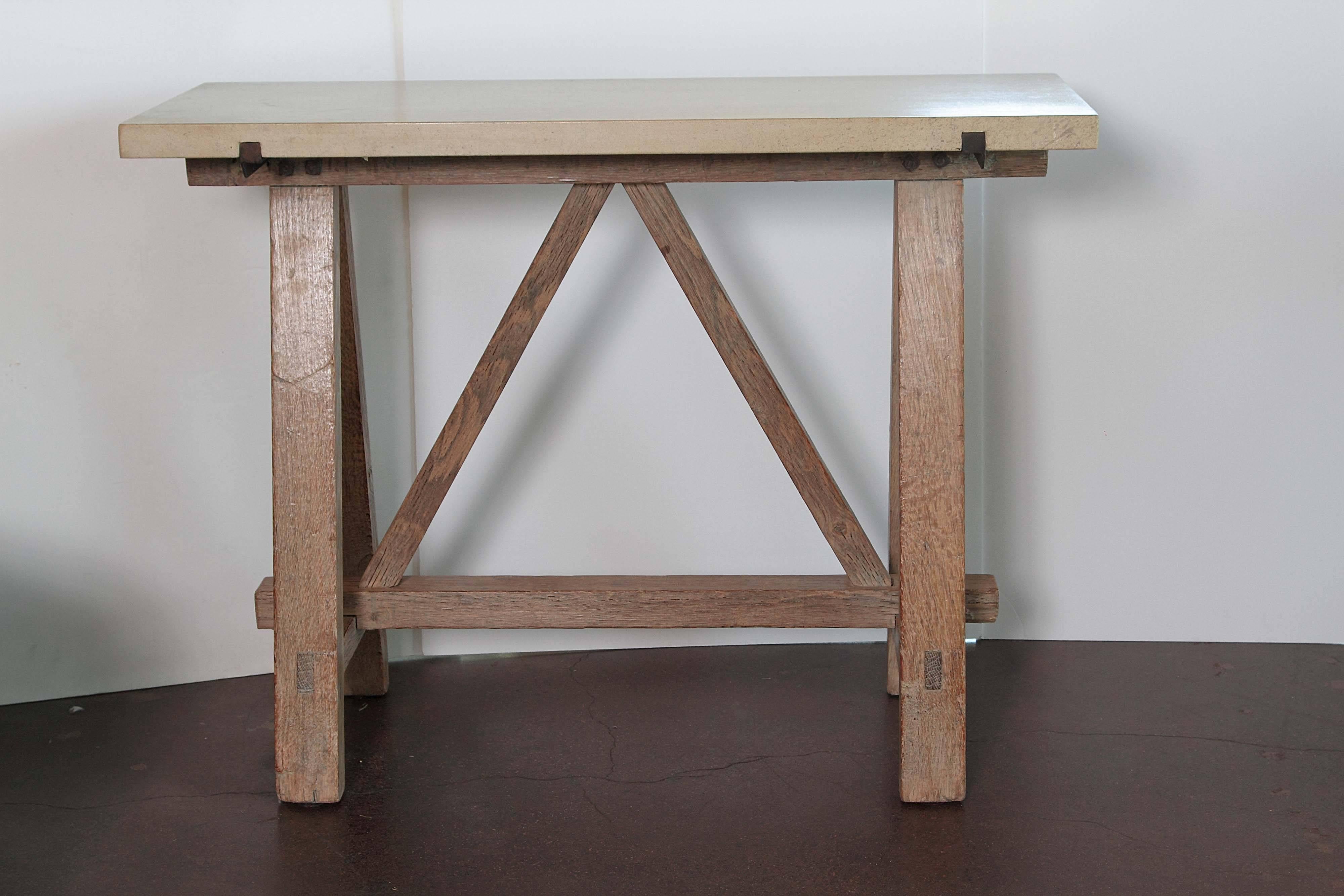 Whether used as a workbench or to help cut the lumber for the French railway systems, these sawhorses was used as a progressive tool in history. 

Antique oak in natural blond tone coloration with upside down 