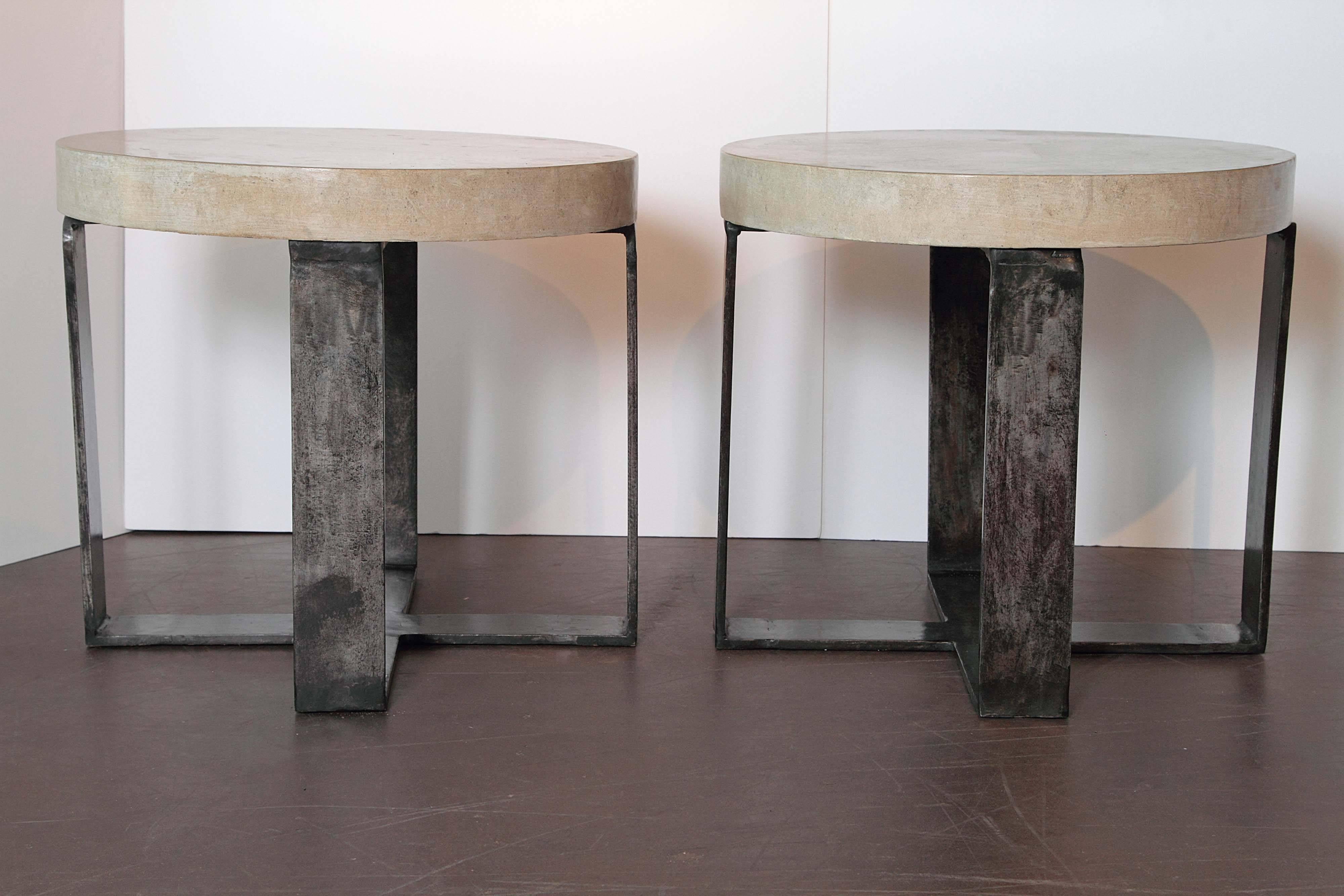Taupe antique limestone X-base end tables: Modern design end tables .

Architectural 