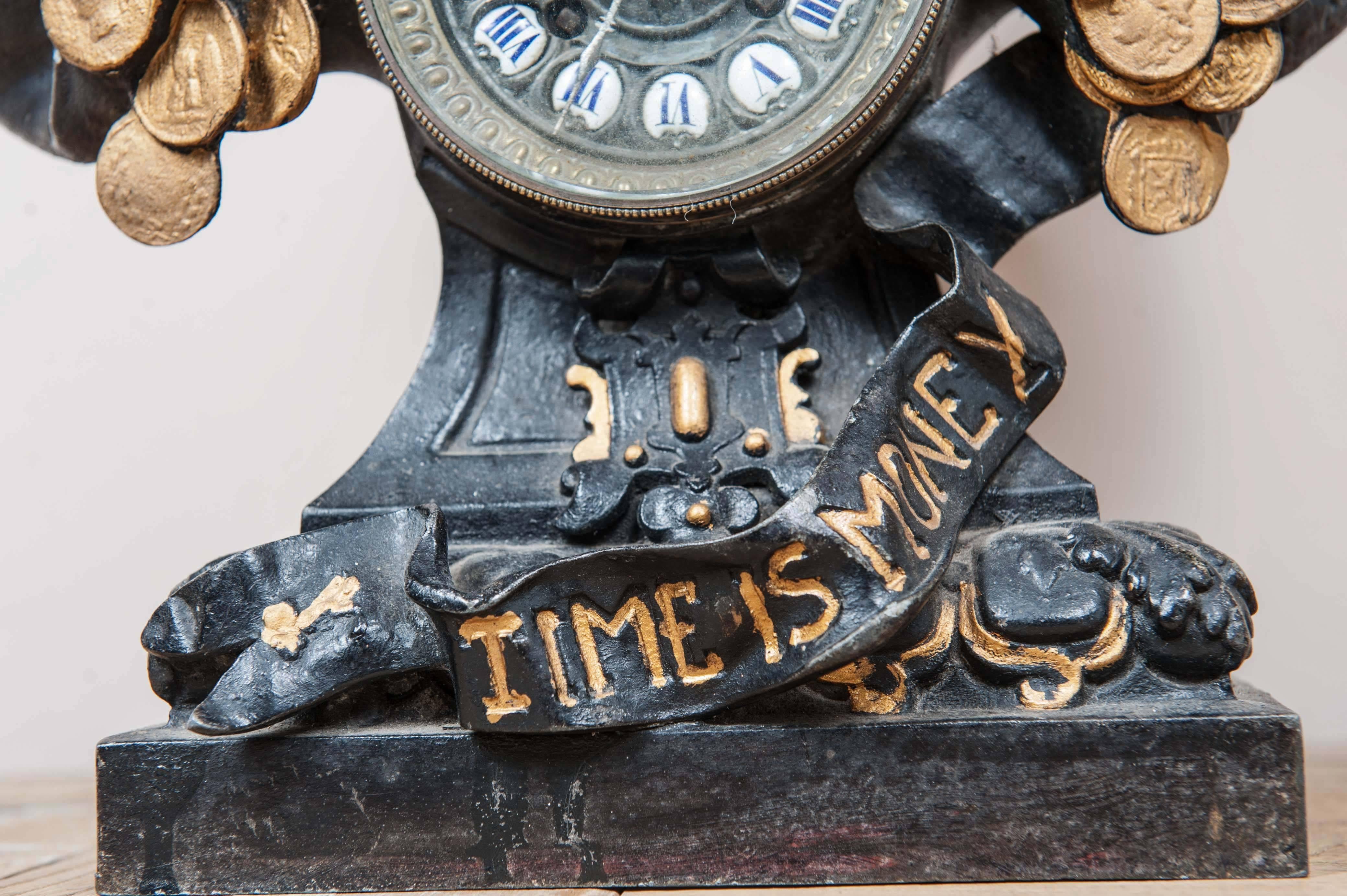 Art Nouveau clock, made of zinc designed by Arthur Waagen.
Text: Time is money.
 