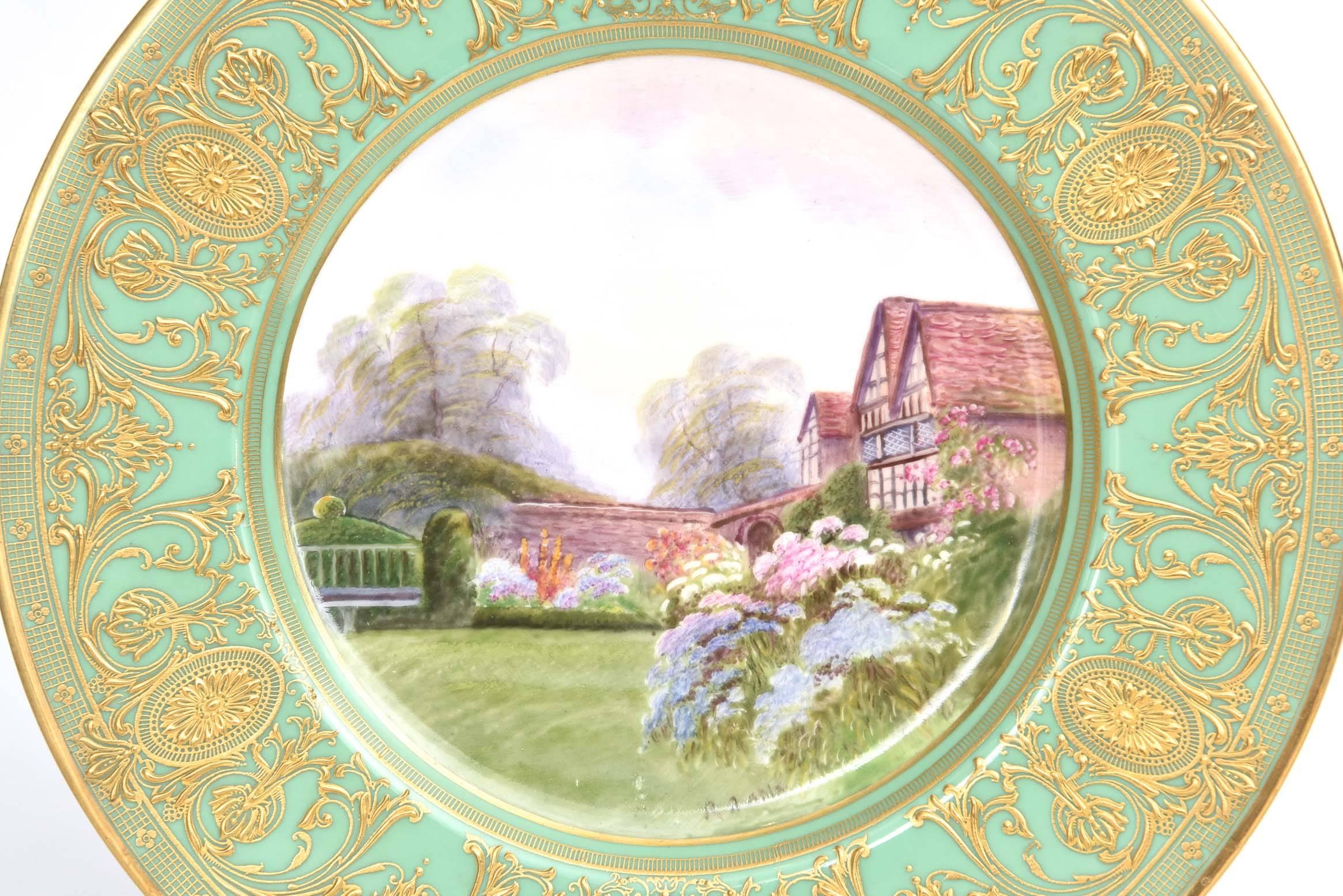 An exquisite scenic work of art on porcelain by one of England's re-known artists: Raymond Rushton. A beautifully detailed lush landscape of Tangley Manor, Surrey. Rich and heavily gilt encrusted on a vibrant green shoulder. Custom ordered through