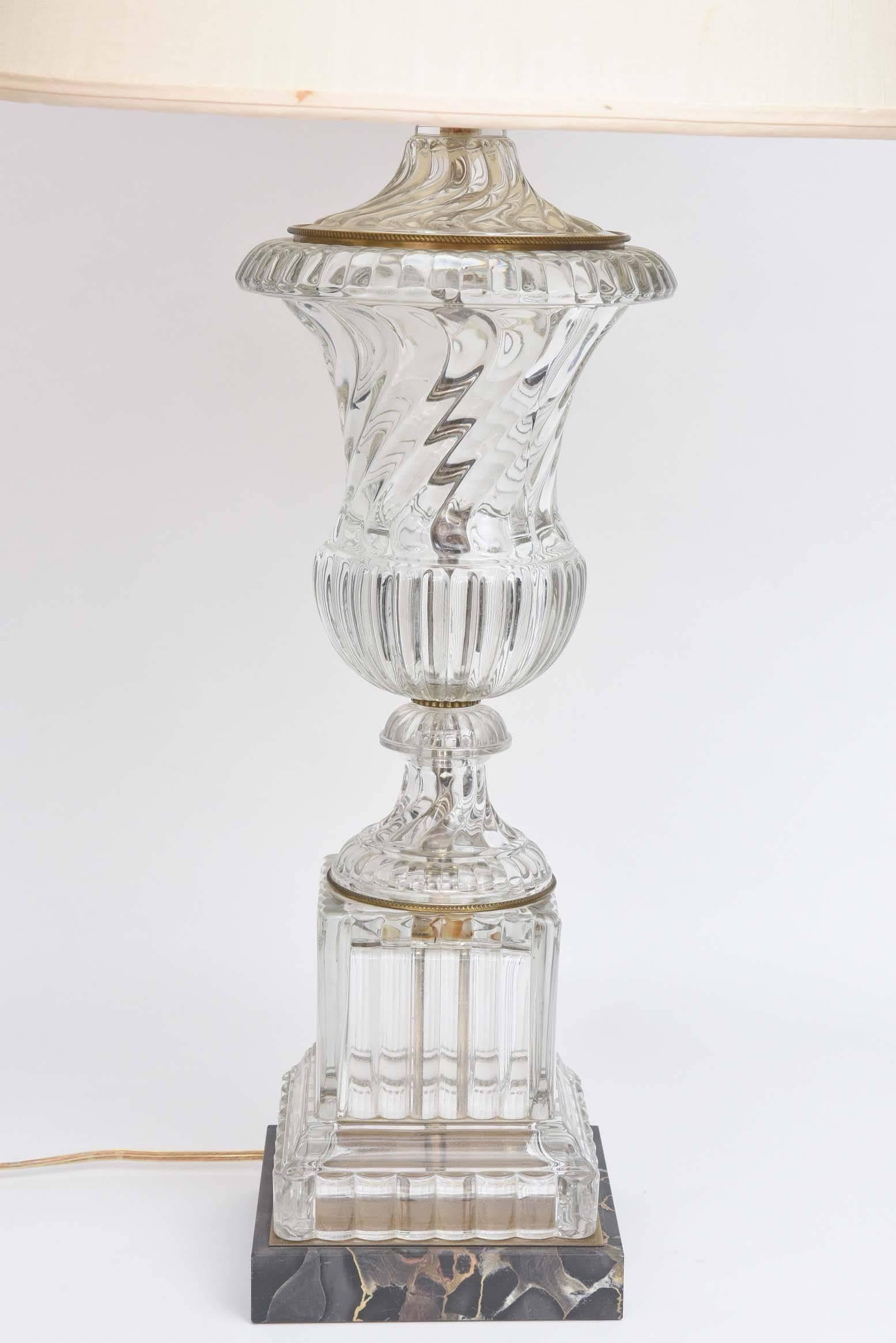 A semi antique crystal lamp that we attribute to Baccarat in fine working condition. Nice details to the gilt metal mounts and decorative details and Classic finial. The crystal is in wonderful condition and the ormolu mounts have wonderful patina.