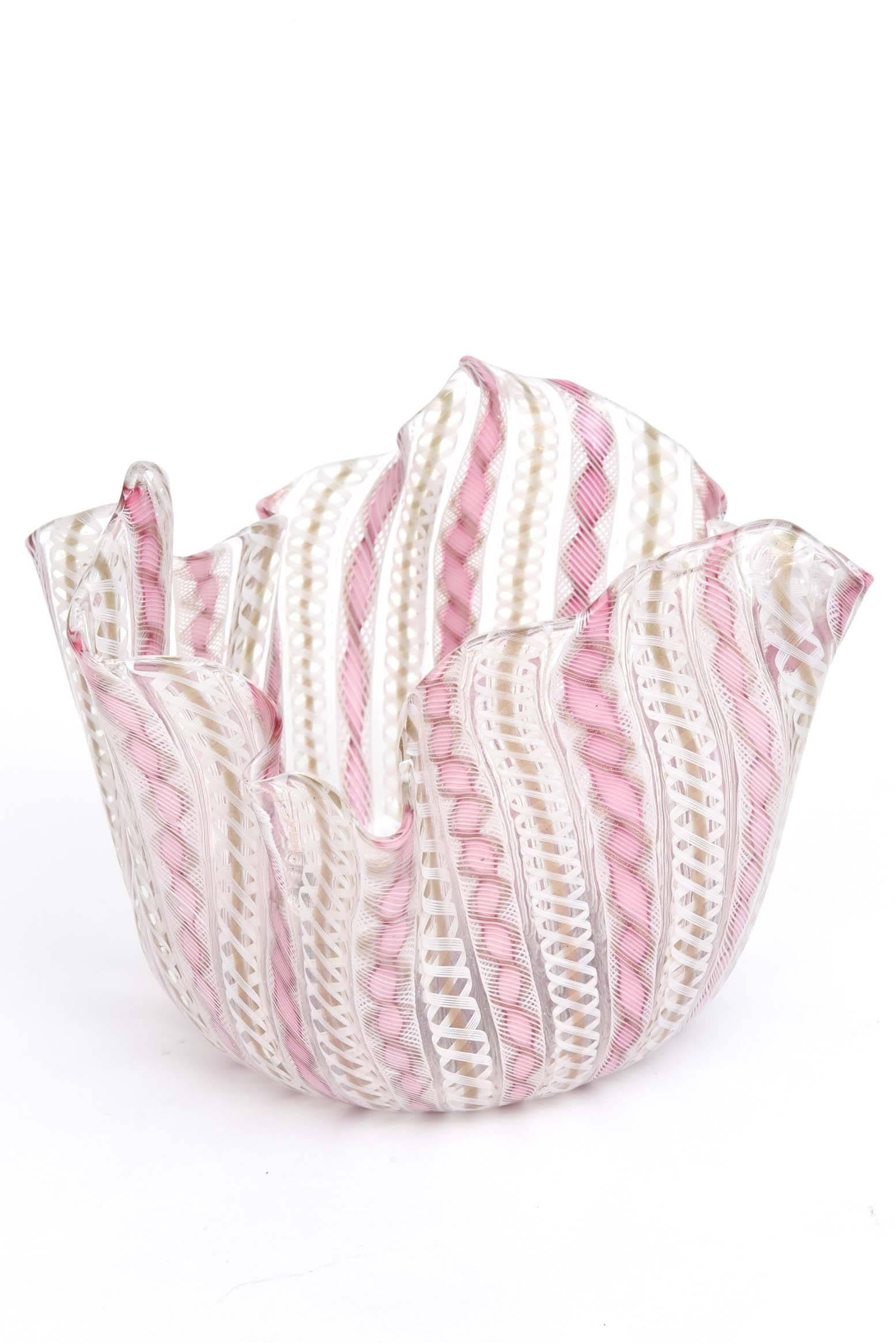 A Classic piece of Mid-Century Modern mouth blown glass from the Isle of Murano. A pretty pink and white striped confection with hand pinched sides and undulating top. A perfect piece for a side table or guest bedroom. In wonderful vintage condition.