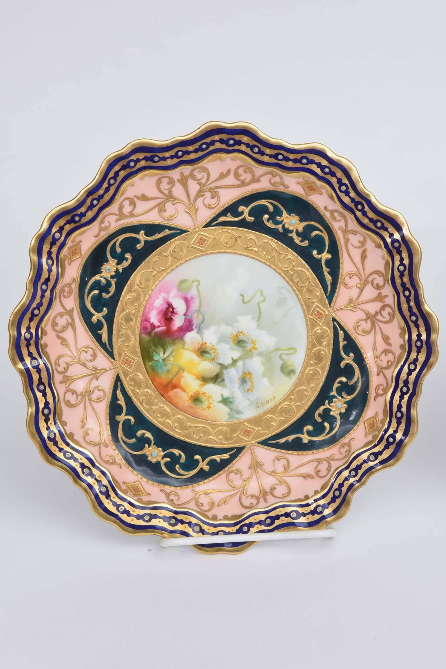 A truly unique and stunning pair for your collection by Adderley & Co England. Their elaborate shape, double color ground, hand enamel jeweling and hand-painted and artist signed florals will not disappoint. Please see all pictures to note the