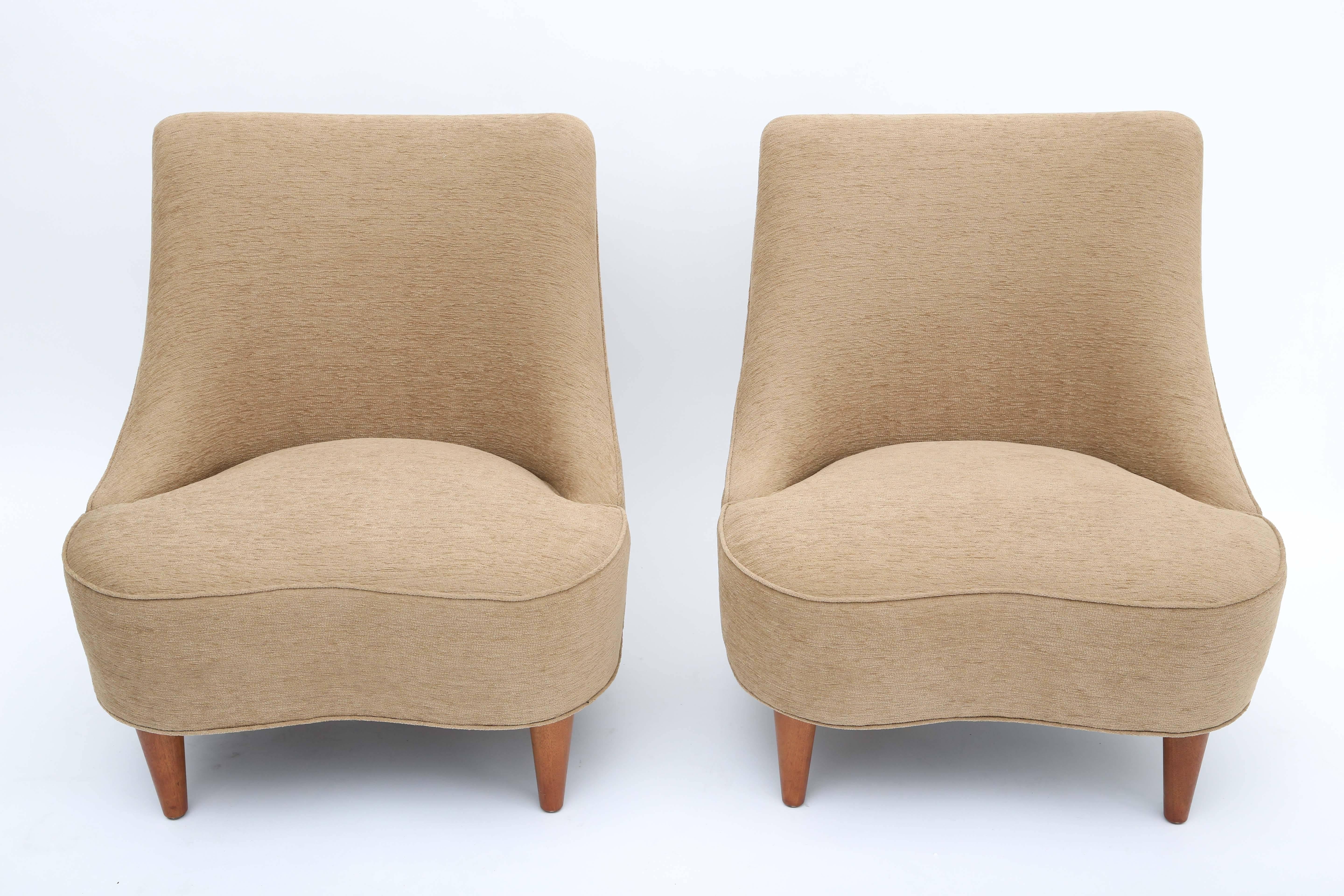 A wonderful matched pair of tear drop lounges
model #5106.
Professionally re-upholstered.