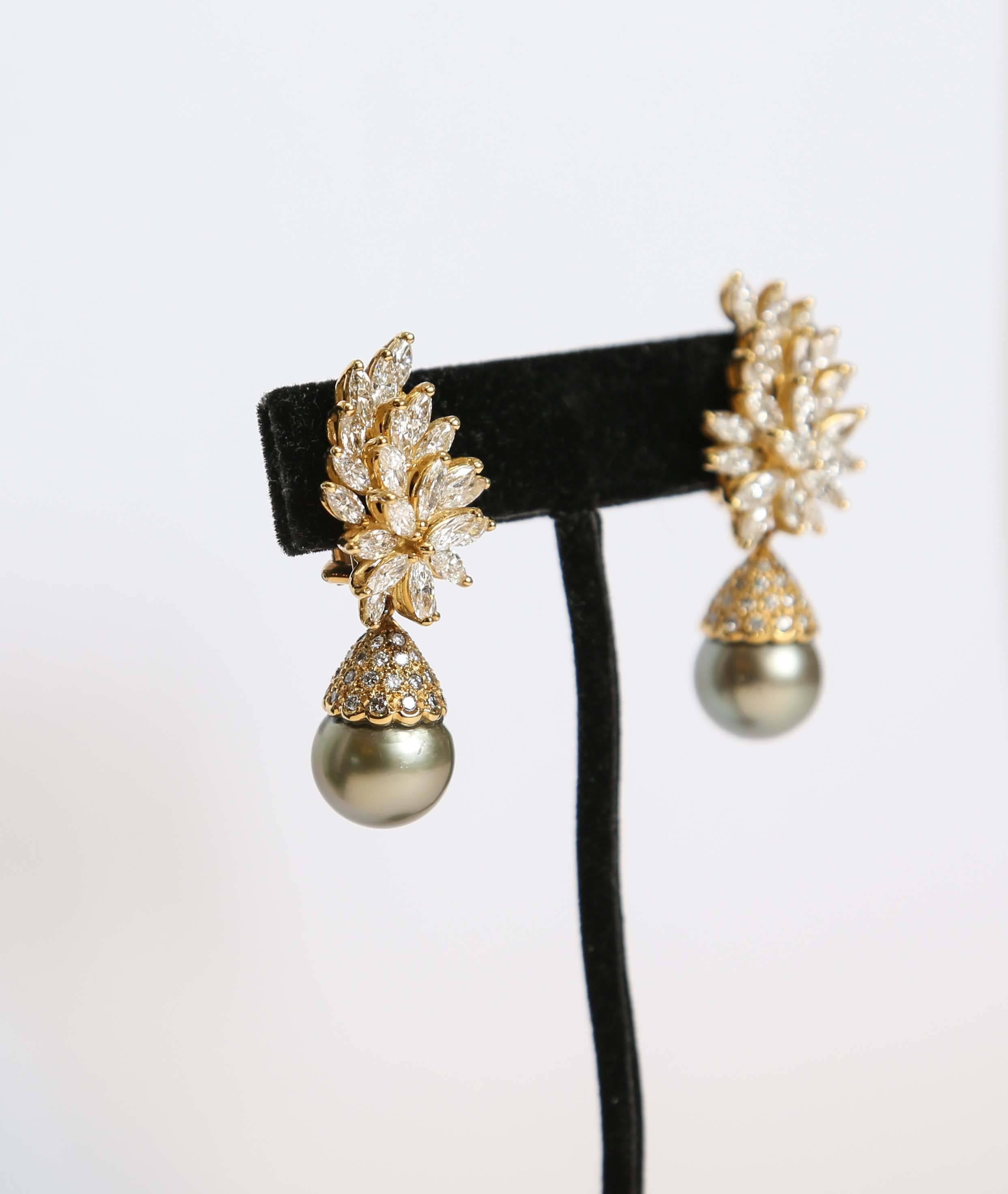 Stunning pair of 18-karat yellow gold earrings with Tahitian black cultured pearls. 6.82-karats of diamonds. Pearls can be detached from earrings.
