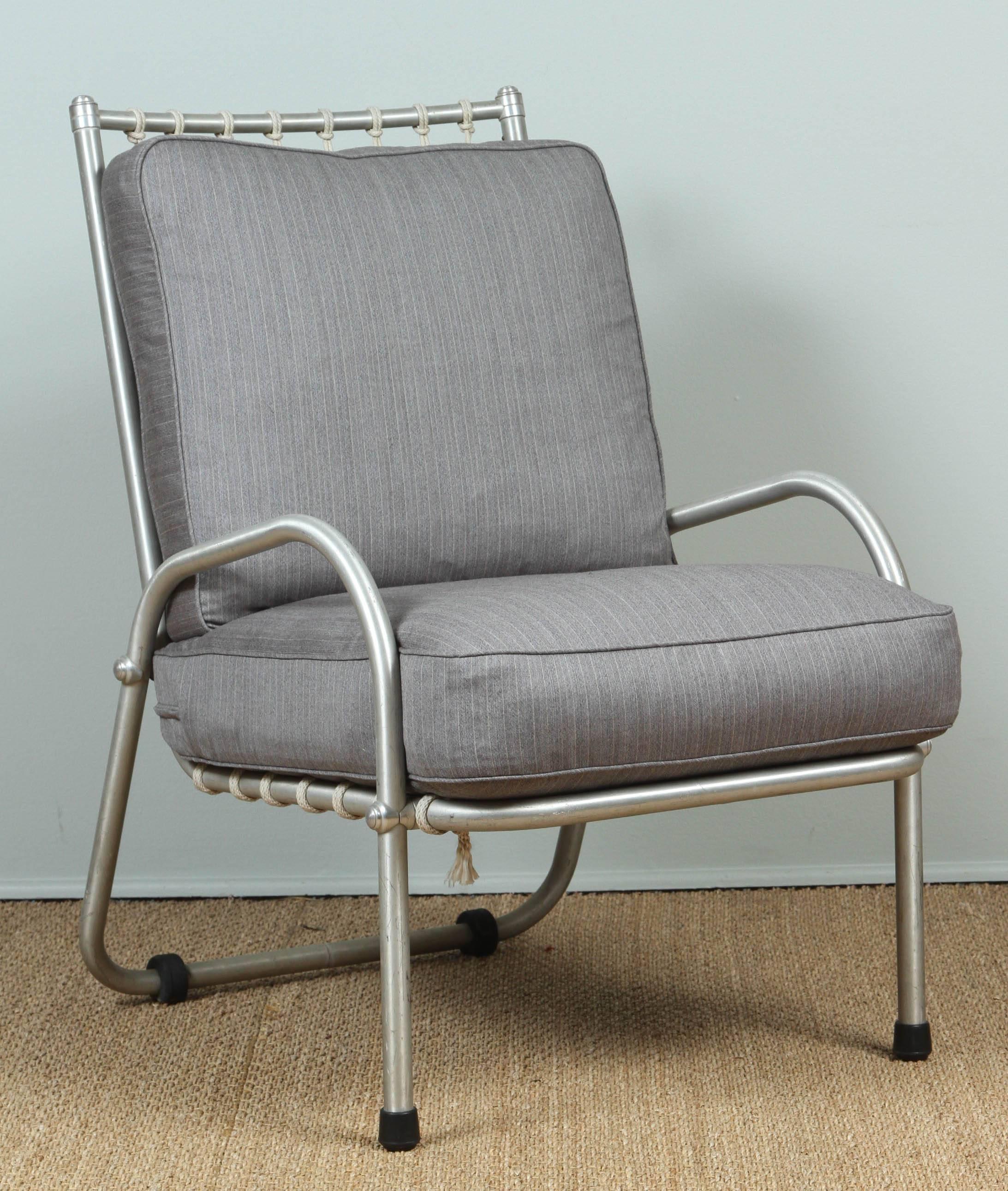 Warren McArthur Aluminum Chairs and rope backs in excellent condition. New back, seat feather and down cushions upholstered in light gray striped suiting wool. 

          