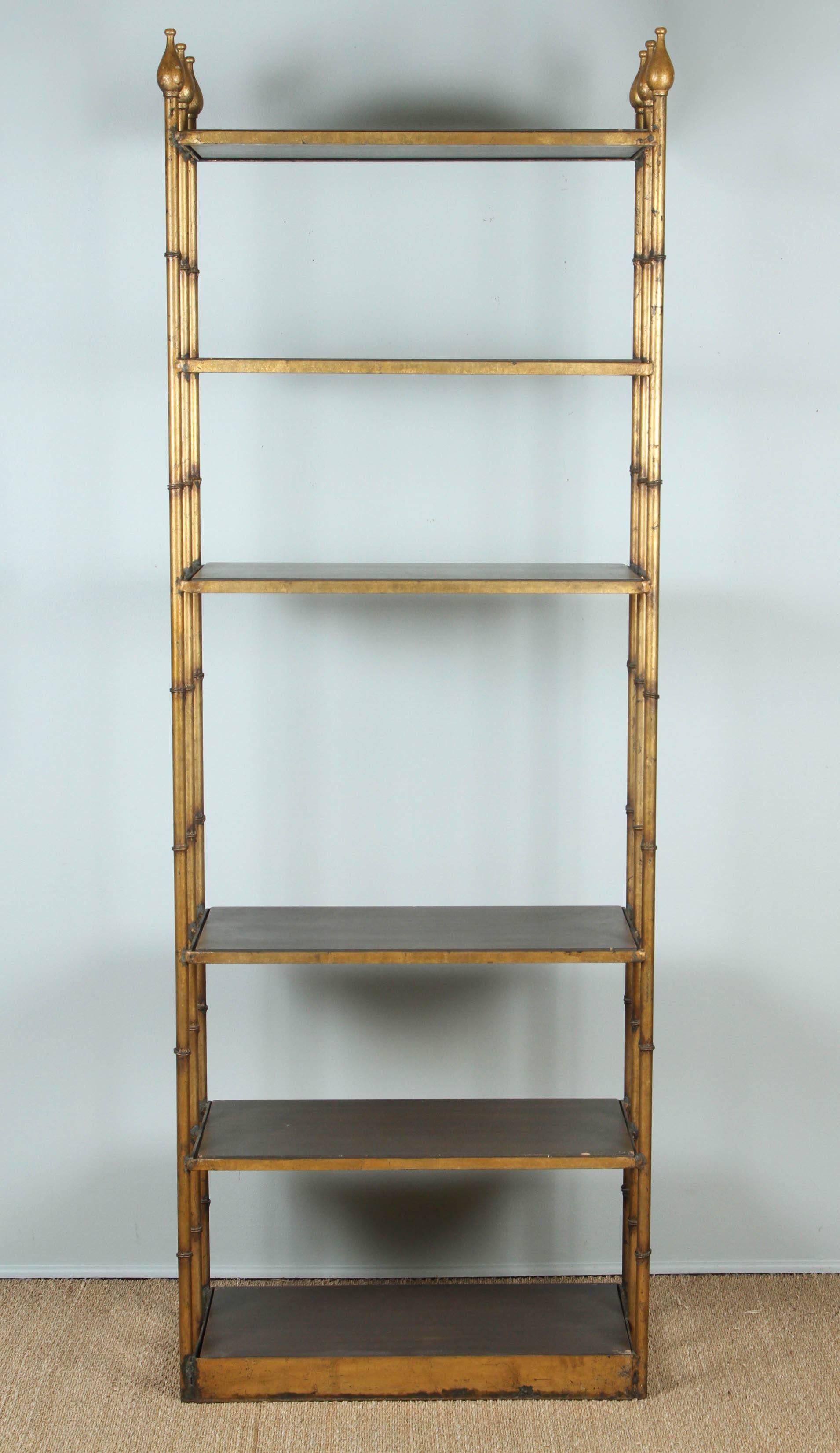 Gilded faux bamboo metal frame with wooden finials and shelves.
