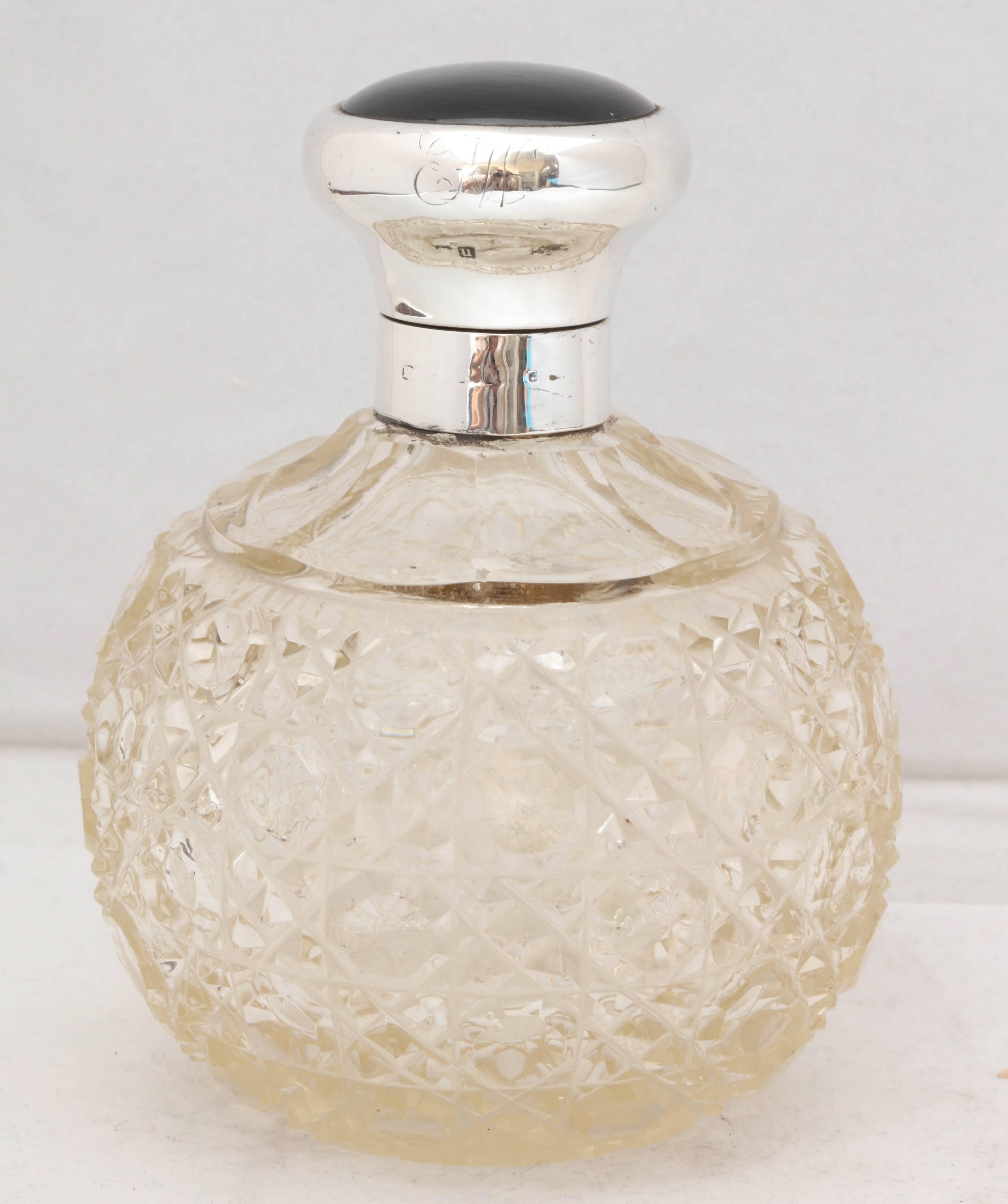 Edwardian, sterling silver and onyx-mounted, hobnail cut crystal perfume bottle, Birmingham, England, 1920, H Matthews - maker. Barely readable monogram on edge of lid. Measures: 4 3/4