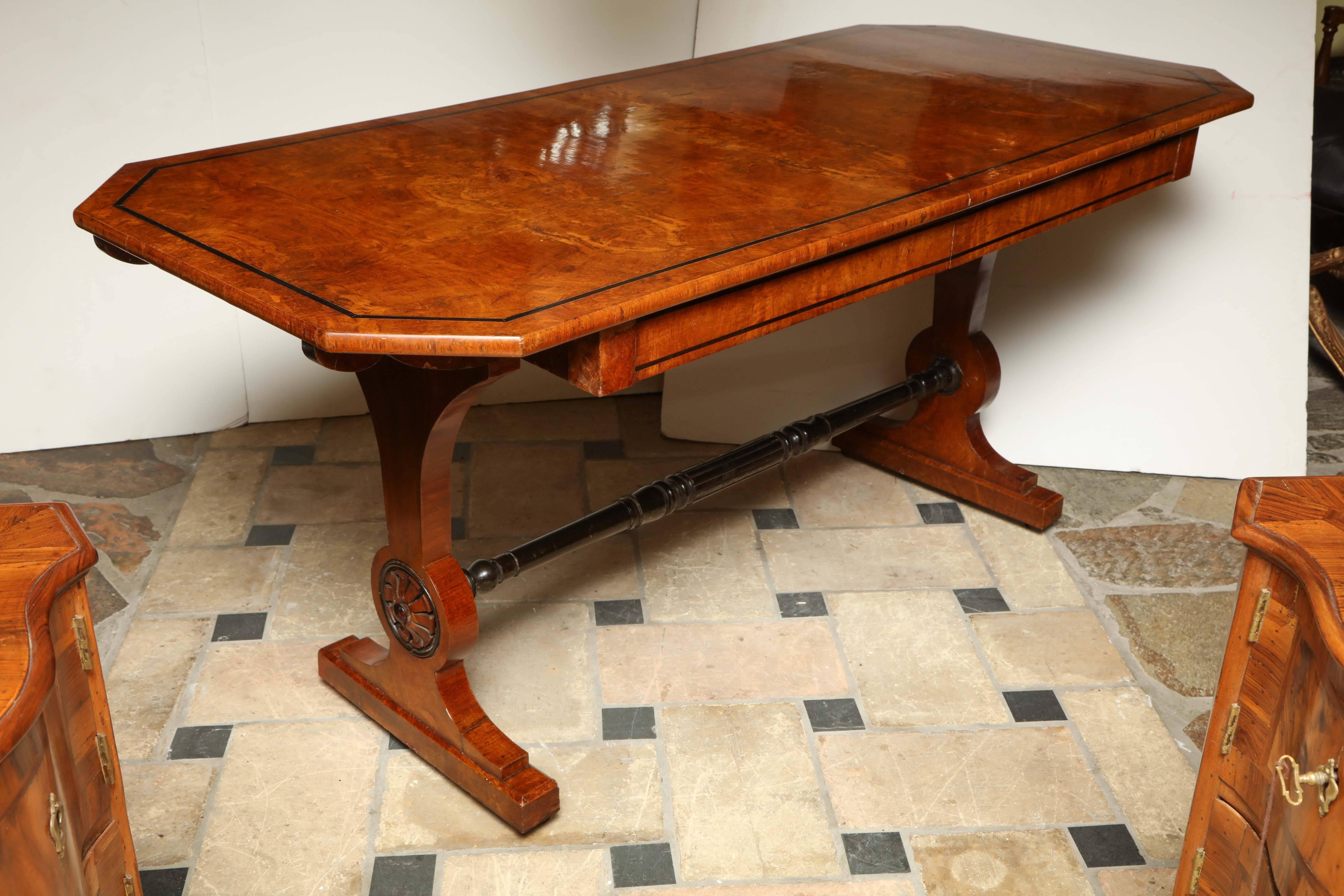 Unusual Regency Trestle end inlaid writing table with two-drawer and stretcher base.