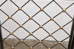 Jean Royere Style Wrought Iron and Brass "Tour Eiffel" Folding Fire Screen