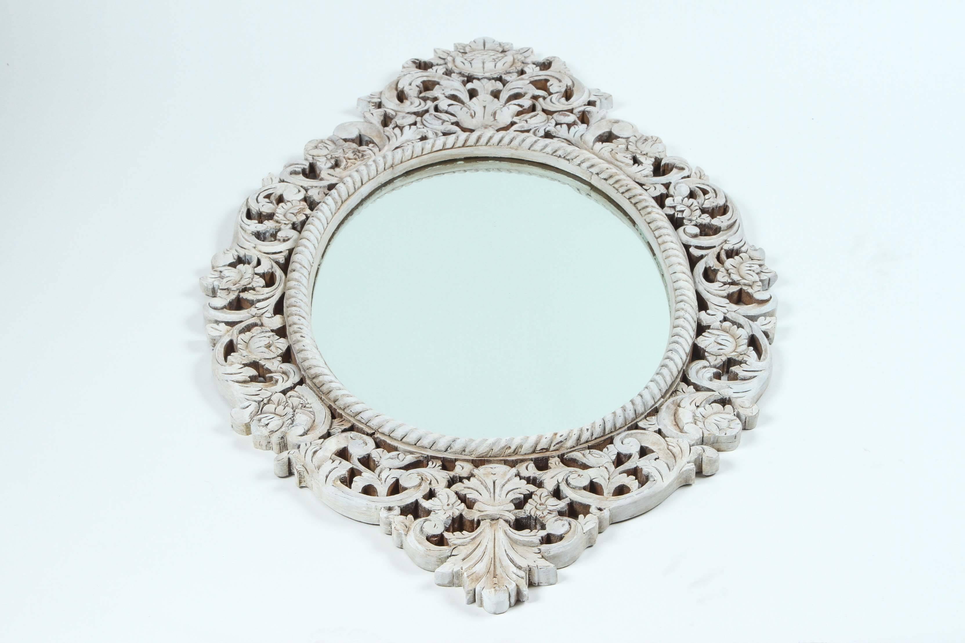 Vintage carved teak frame with oval mirror. Wood has been newly finished with custom antique glaze.