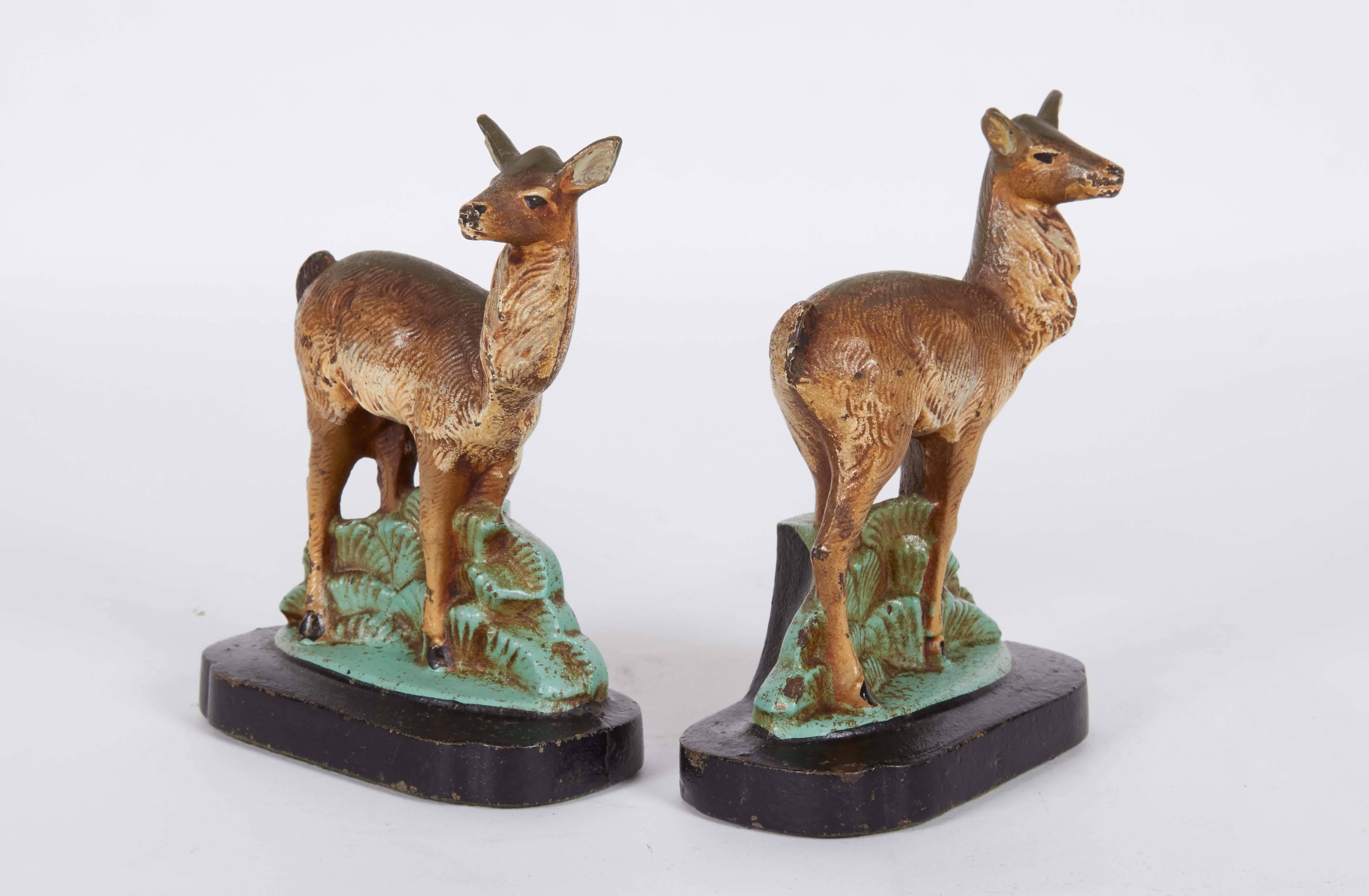 A pair of Art Deco era figurine bookends by Hubley, produced circa 1940s, each in cast iron, depicting a doe. Markings include number '399' to bases of either figure. These figures remain in very good vintage condition, wear consistent with age.