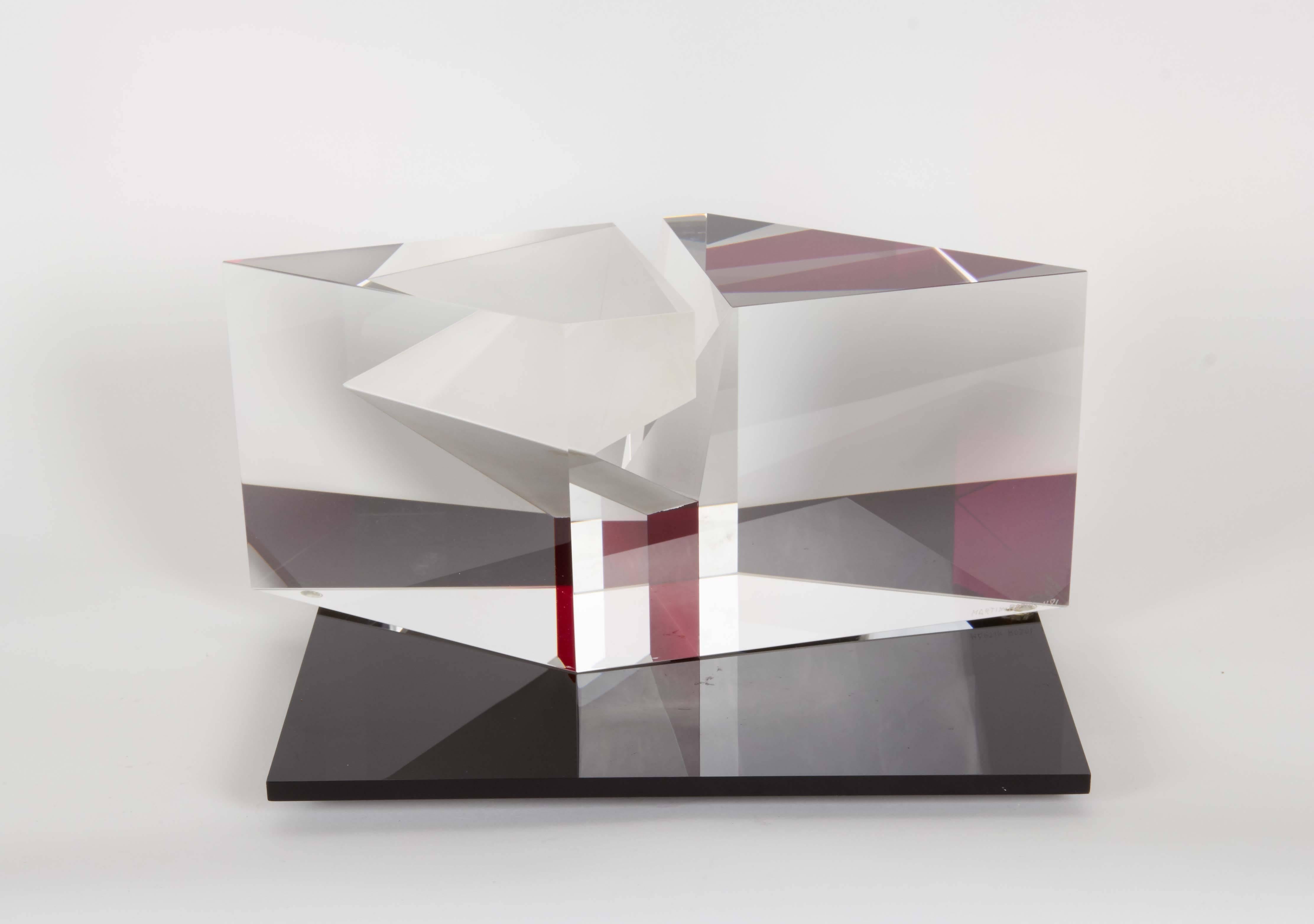 A modernist glass sculpture by Czech born contemporary glass artist Martin Rosol, clear with pink tint and frosted details, creating a unique optical effect, standing on a flat rotating base in black plexiglass. Markings include [Martin Rosol 1191]