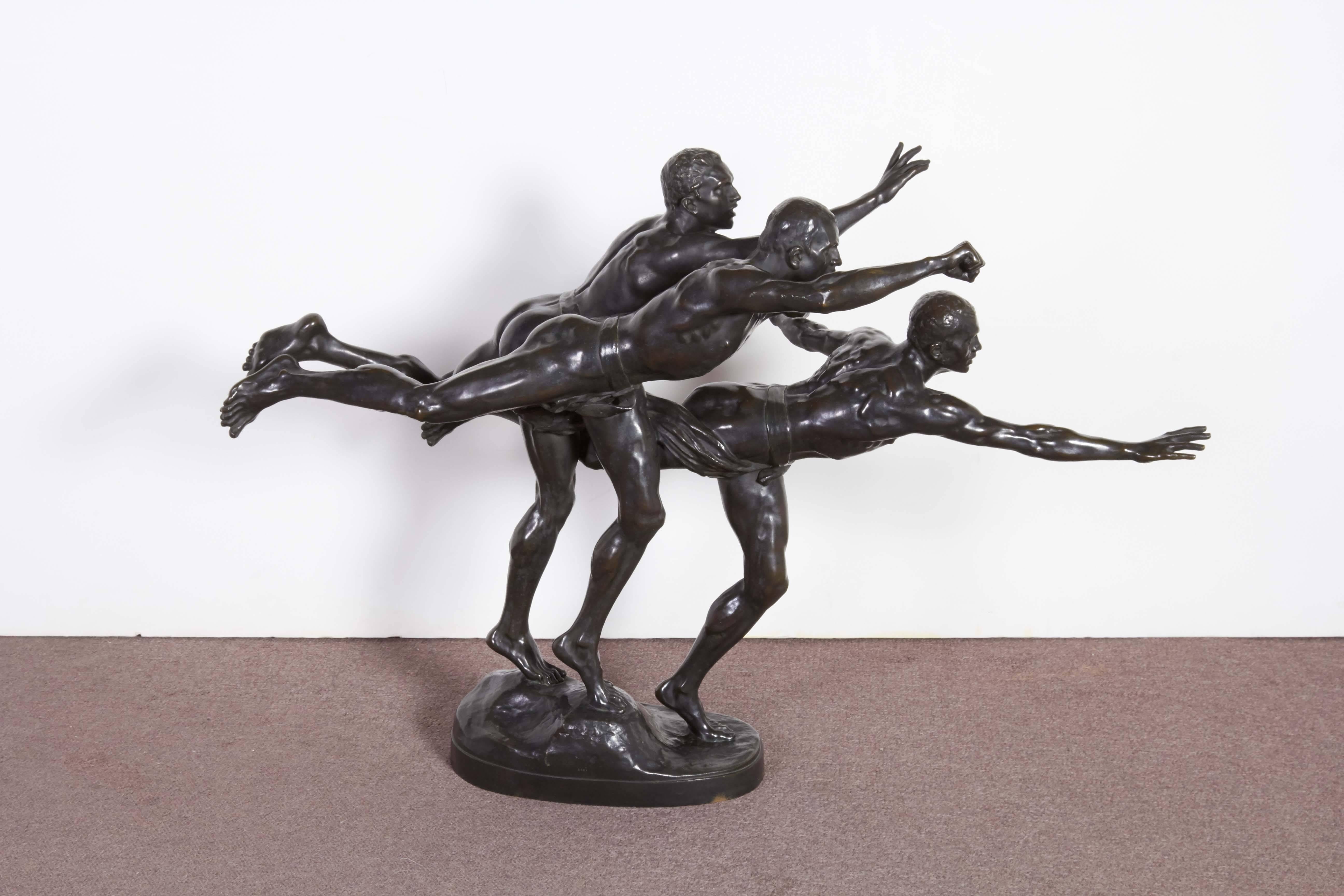 A fine and large French 19th century patinated bronze figural group “Au But