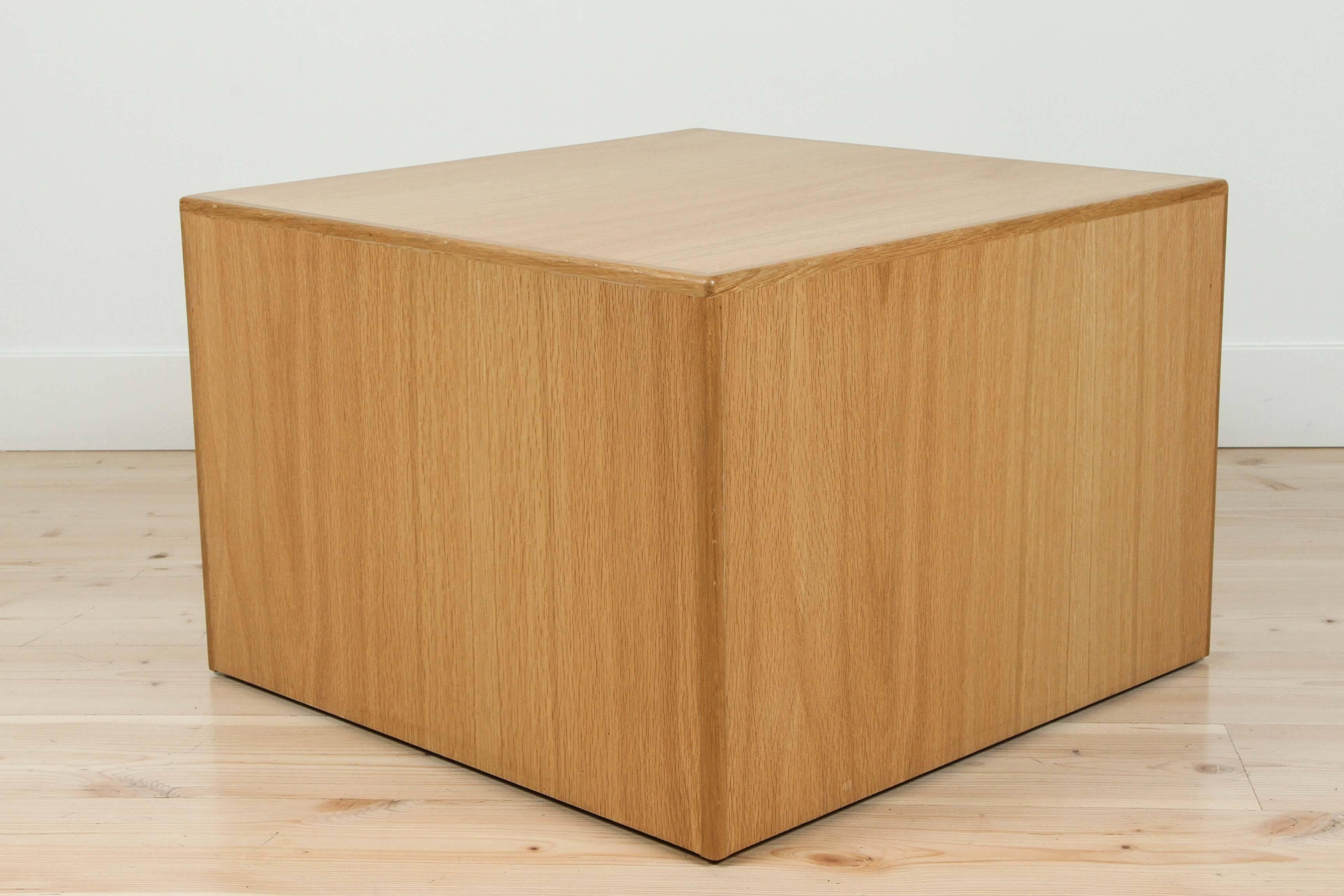 The Wood Cube Table is a cube-shaped side table that is covered on five sides with American Walnut or White Oak with solid wood edge banding and a 3/4″ floating inset base. This pair pictured in Oiled Oak.

Available to order in various finishes