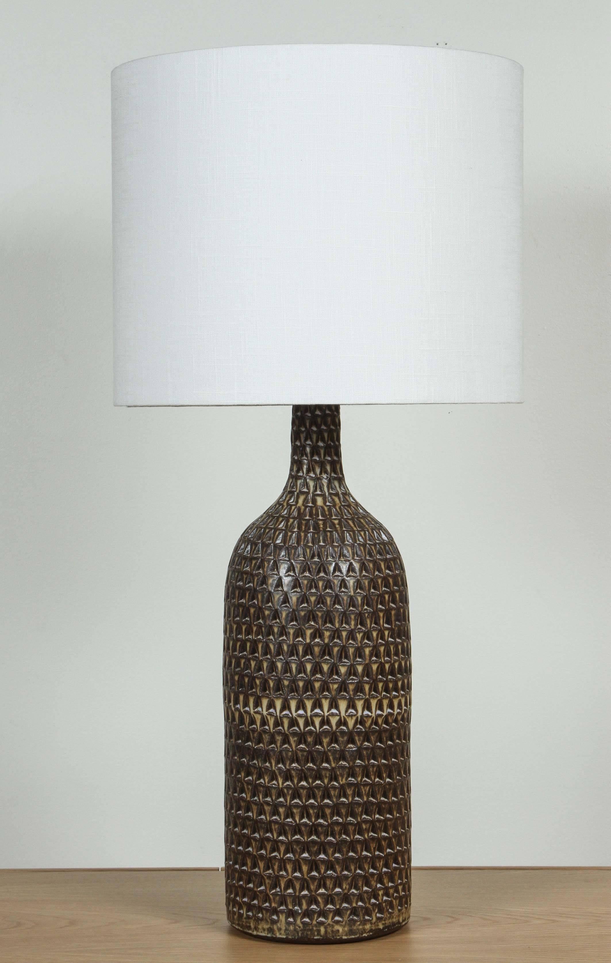 Extra large carved bottle lamp by Victoria Morris.