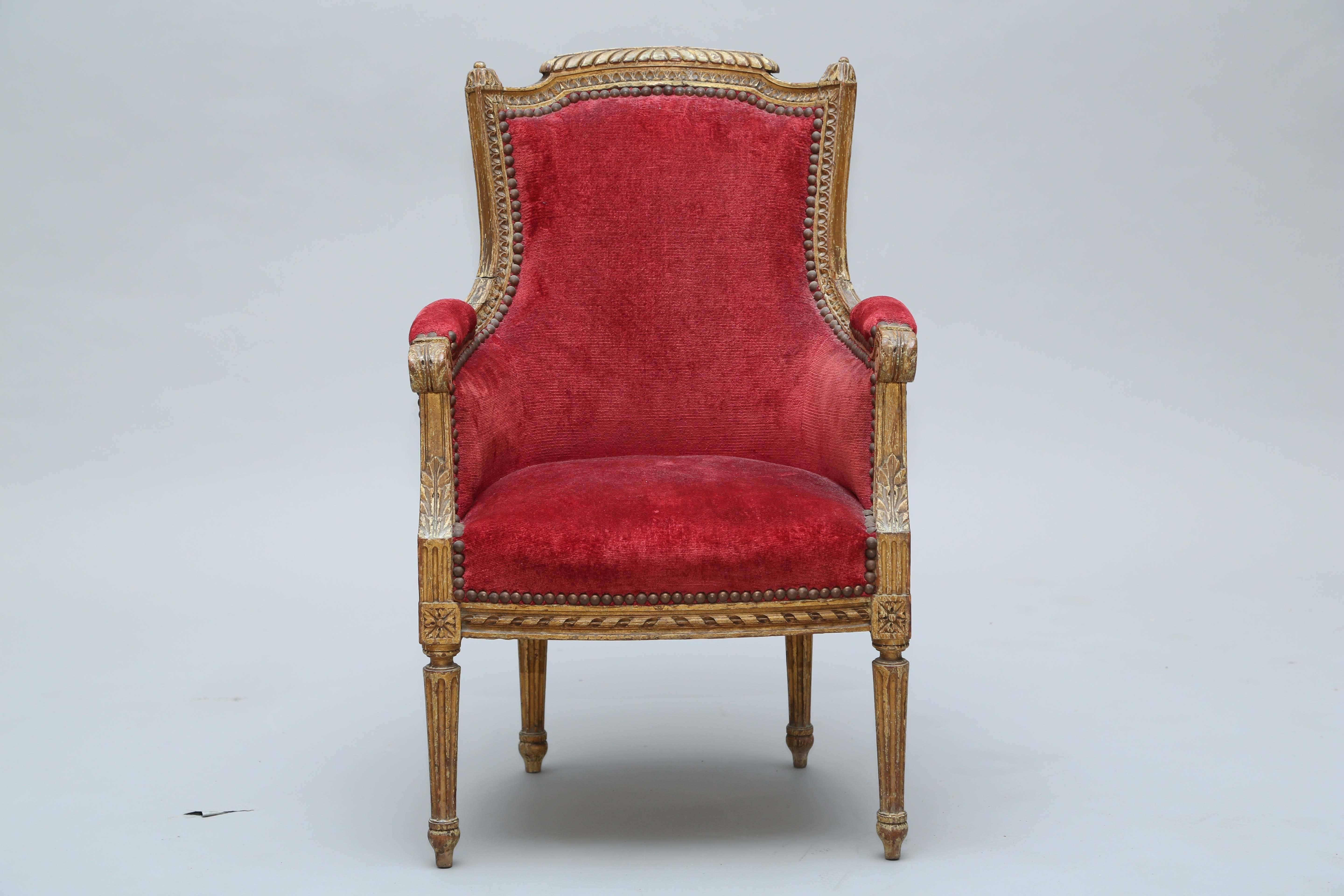 Child sized, Louis XVI bergere chair, having a channeled frame, carved with gadrooning, raised on round, tapering, fluted legs and ending in toupie feet.

Stock ID: D9335