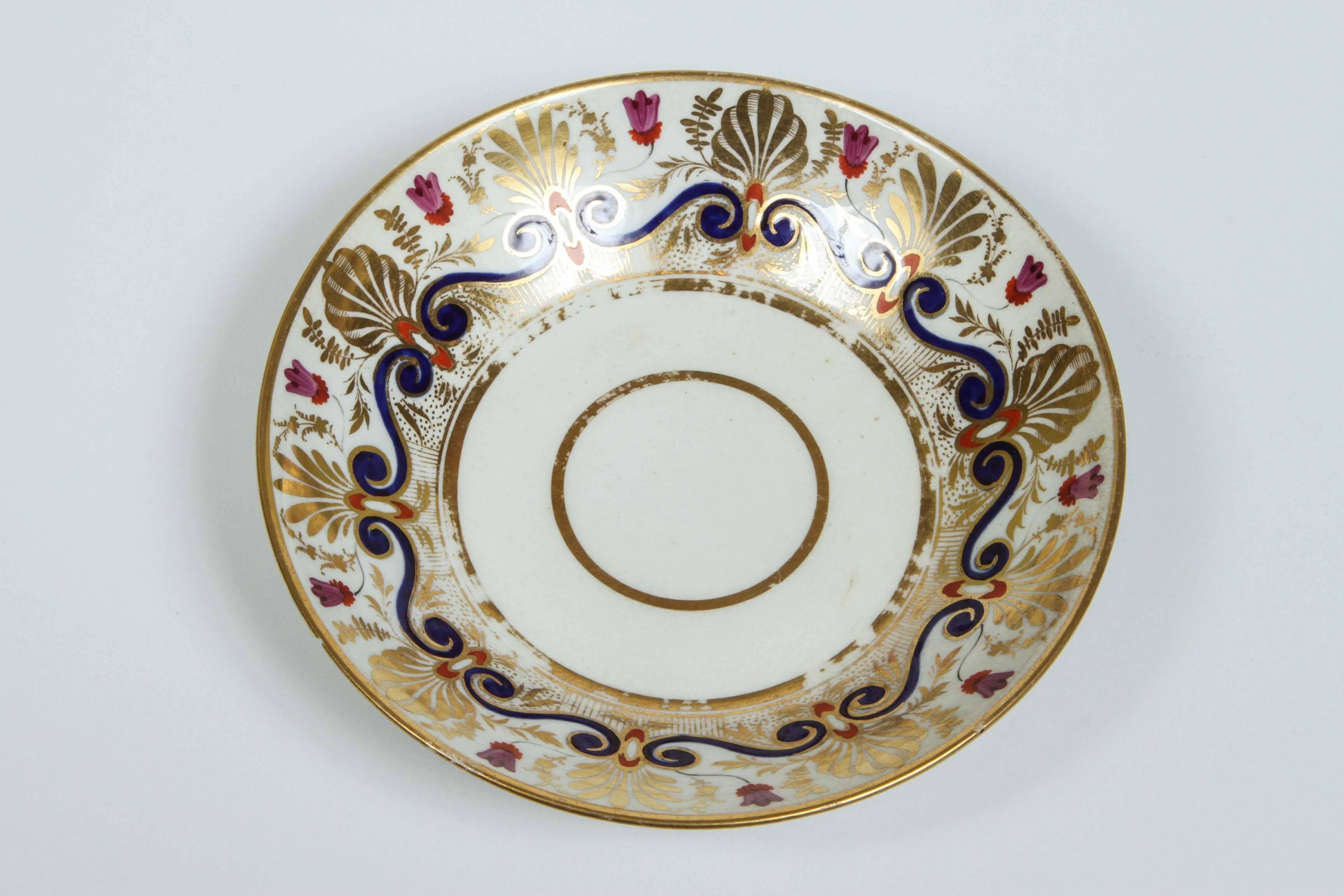 An English Derby saucer with gilt and polychrome decoration, circa 1815.