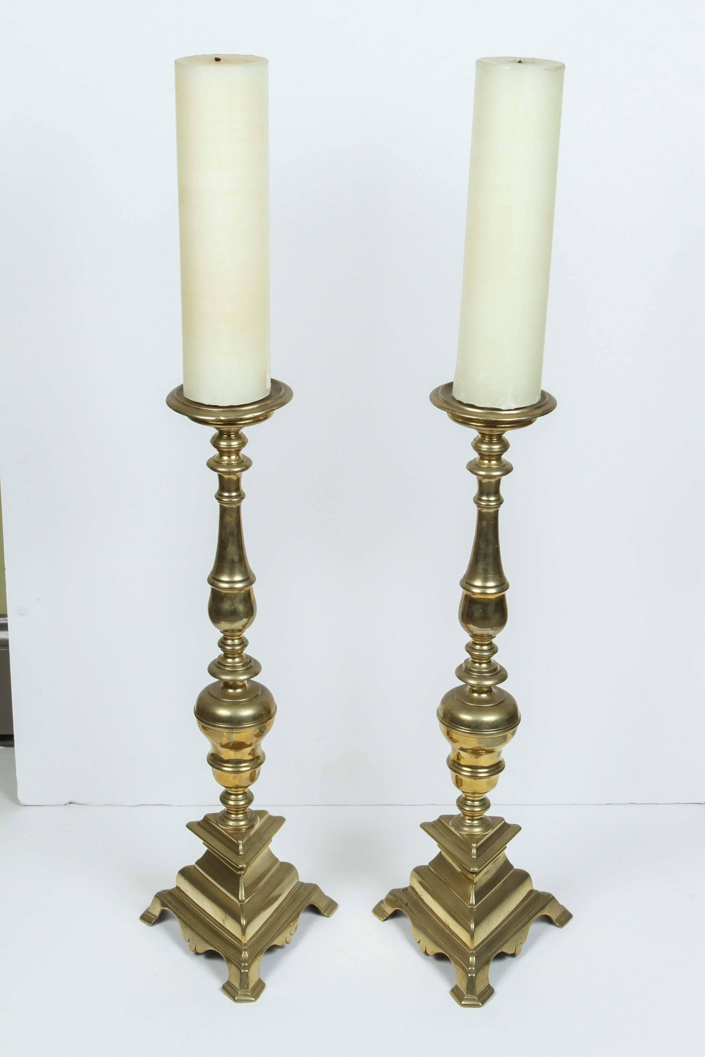 A pair of 18th century Italian brass prickets sticks from Estate of Bob Hope.