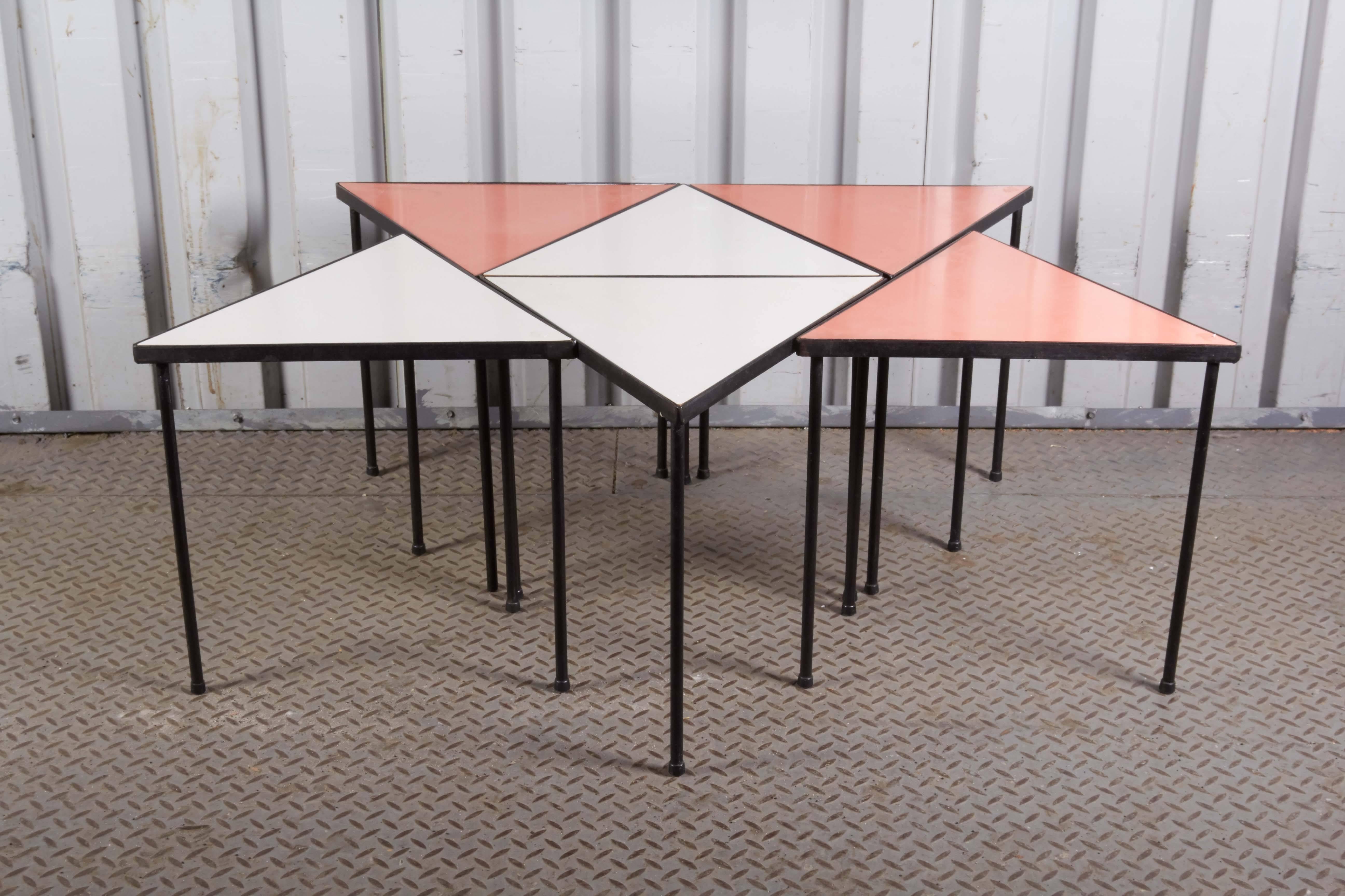 Set of six melamine stacking tables.