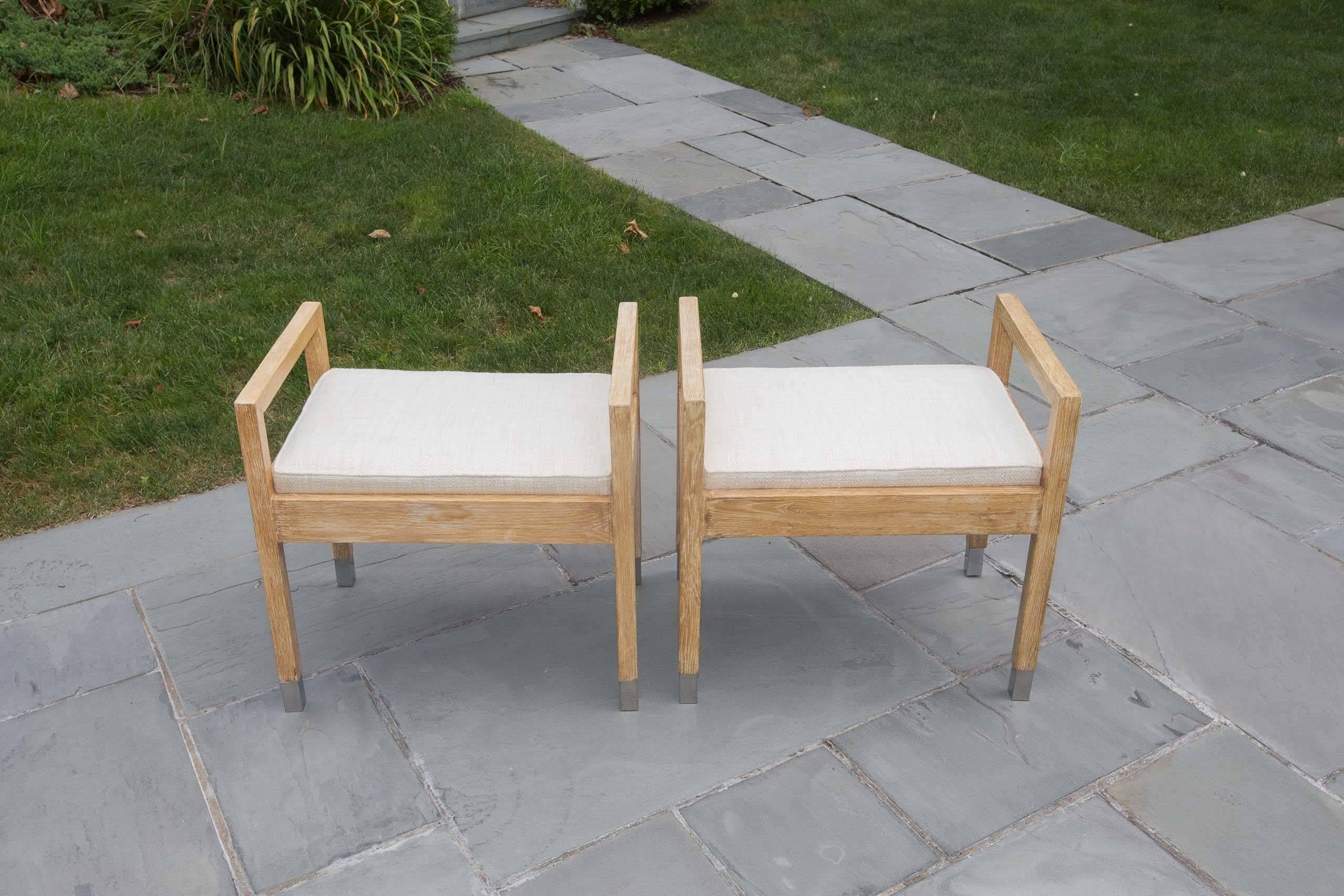 Pair of upholstered wood benches with chrome tip legs.