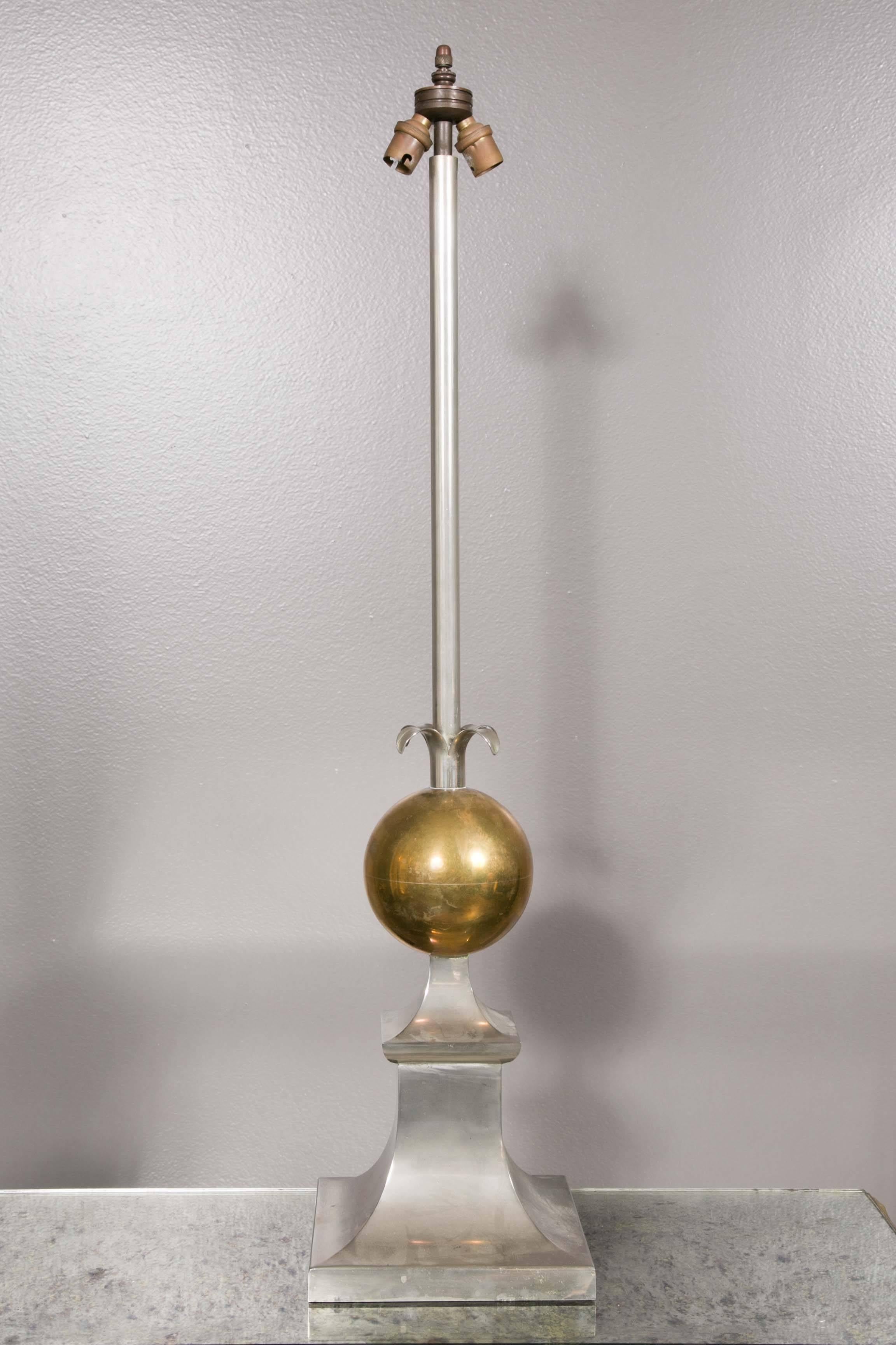 Large pair of lamps, steel and brass with a stylised fruit,
circa 1970.
