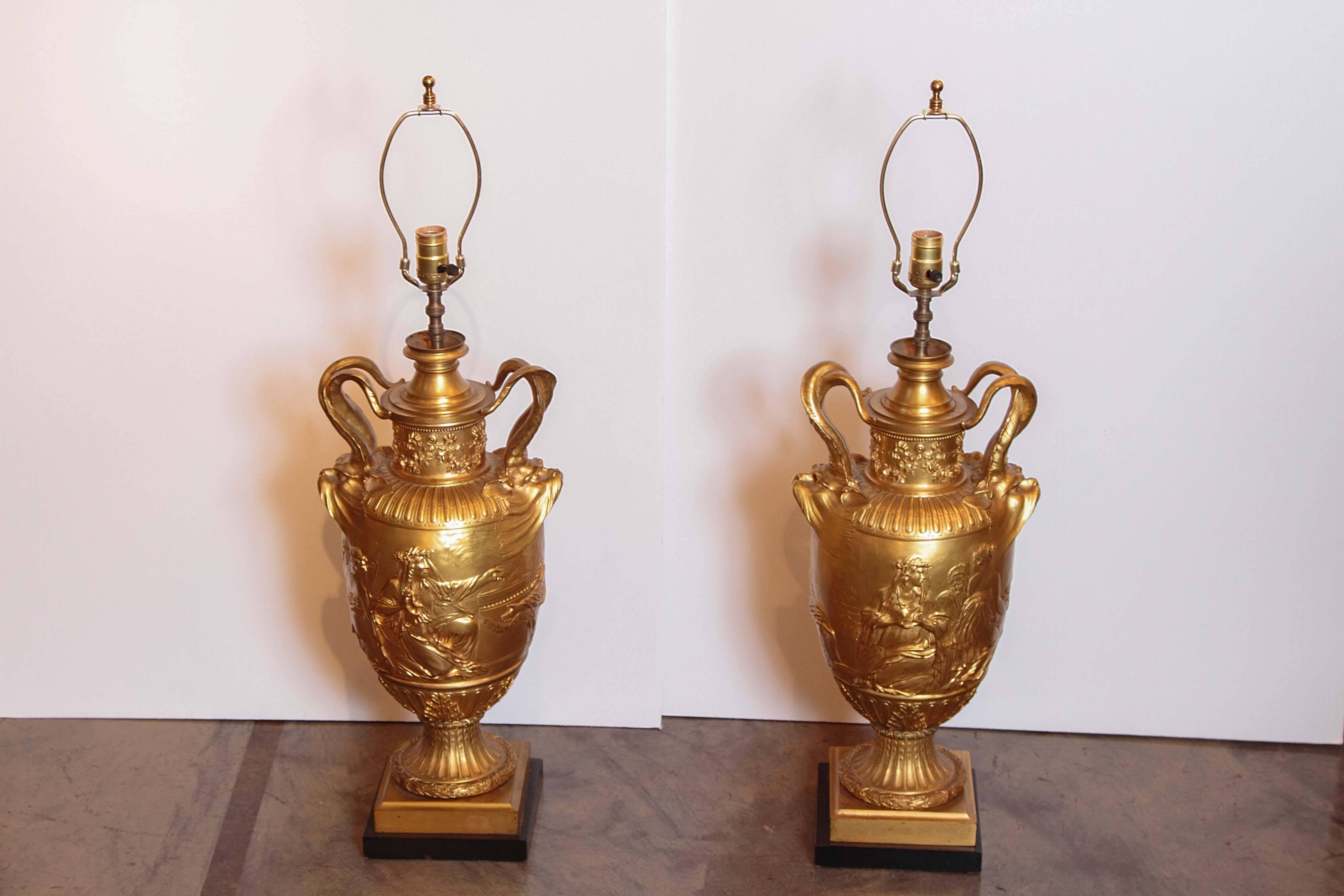 19th century pair of the finest gilt bronze classical urns signed F Barbedienne. Custom wired and silk pleated custom shades added. Fine example of his Barbedienne's work. One of the largest pairs on the market.

               