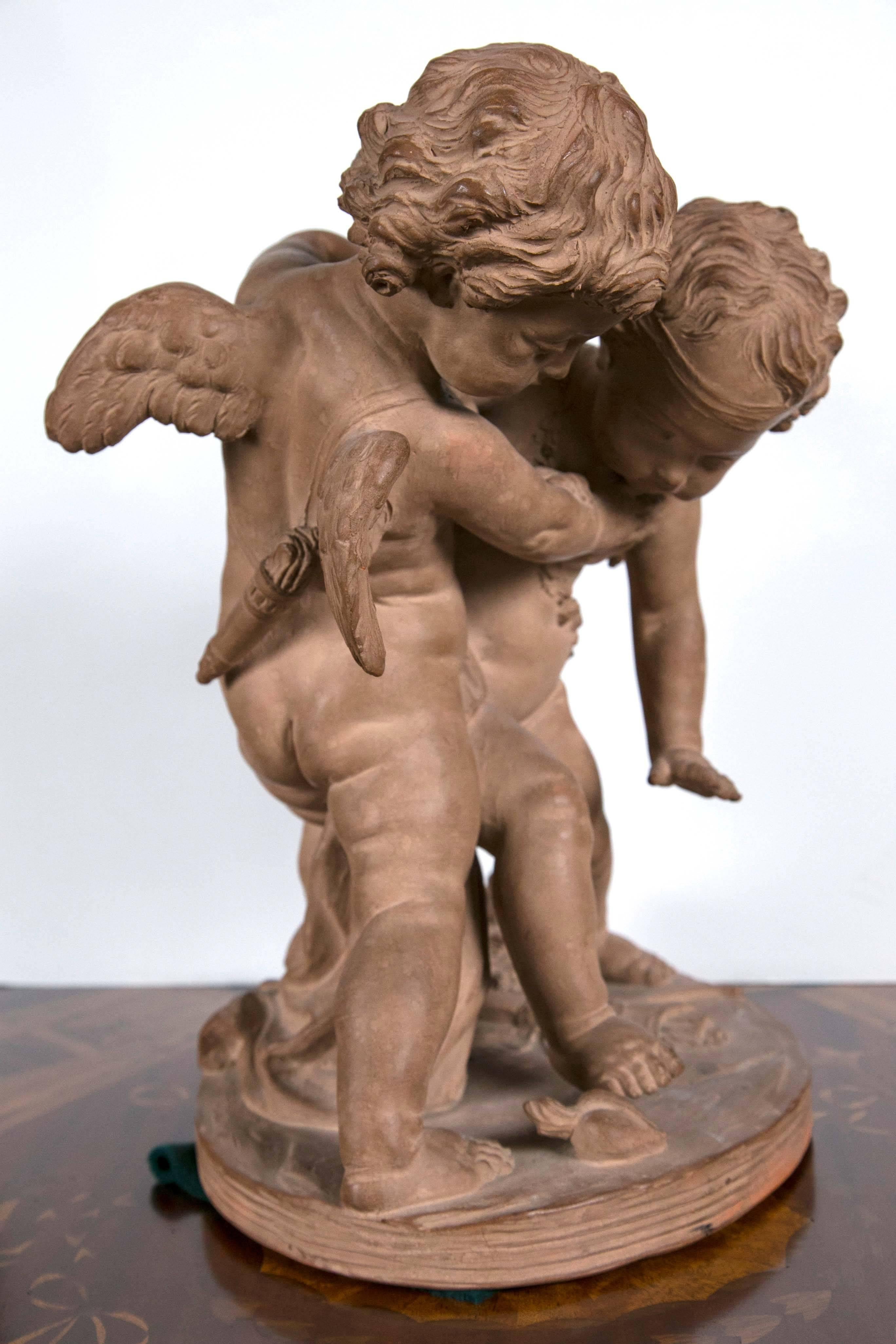 French Terracotta Group of Two Cupids For Sale