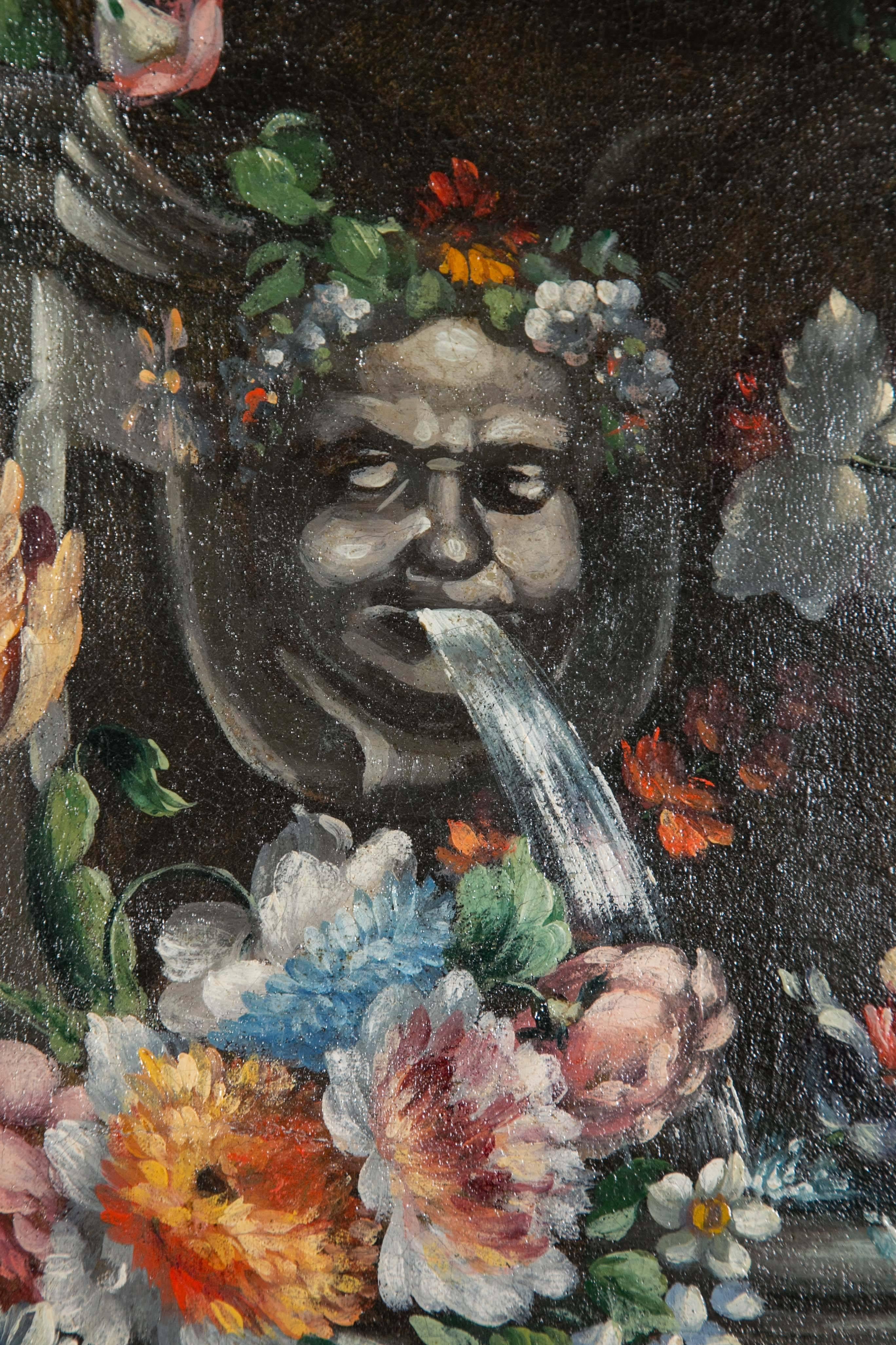 An unusual shaped oil on canvas with flowers, fruits and central water spouting mask. The frame is original to the painting. Continental school, mid-19th century.