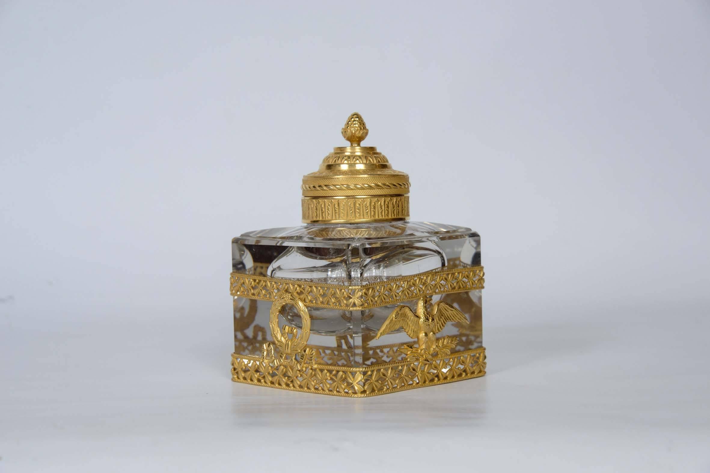 Inkwell in crystal decorated with gilded bronze.