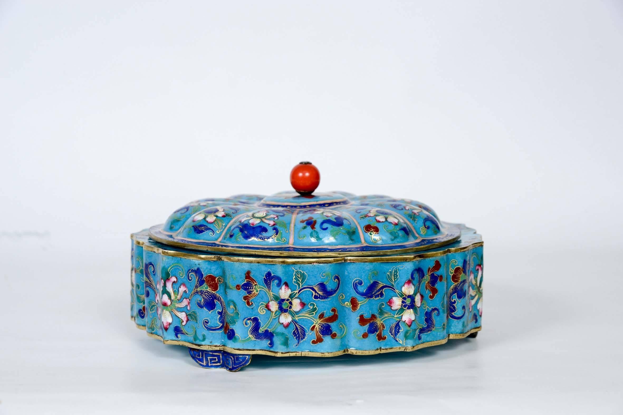 Charming enameled box with floral decor.