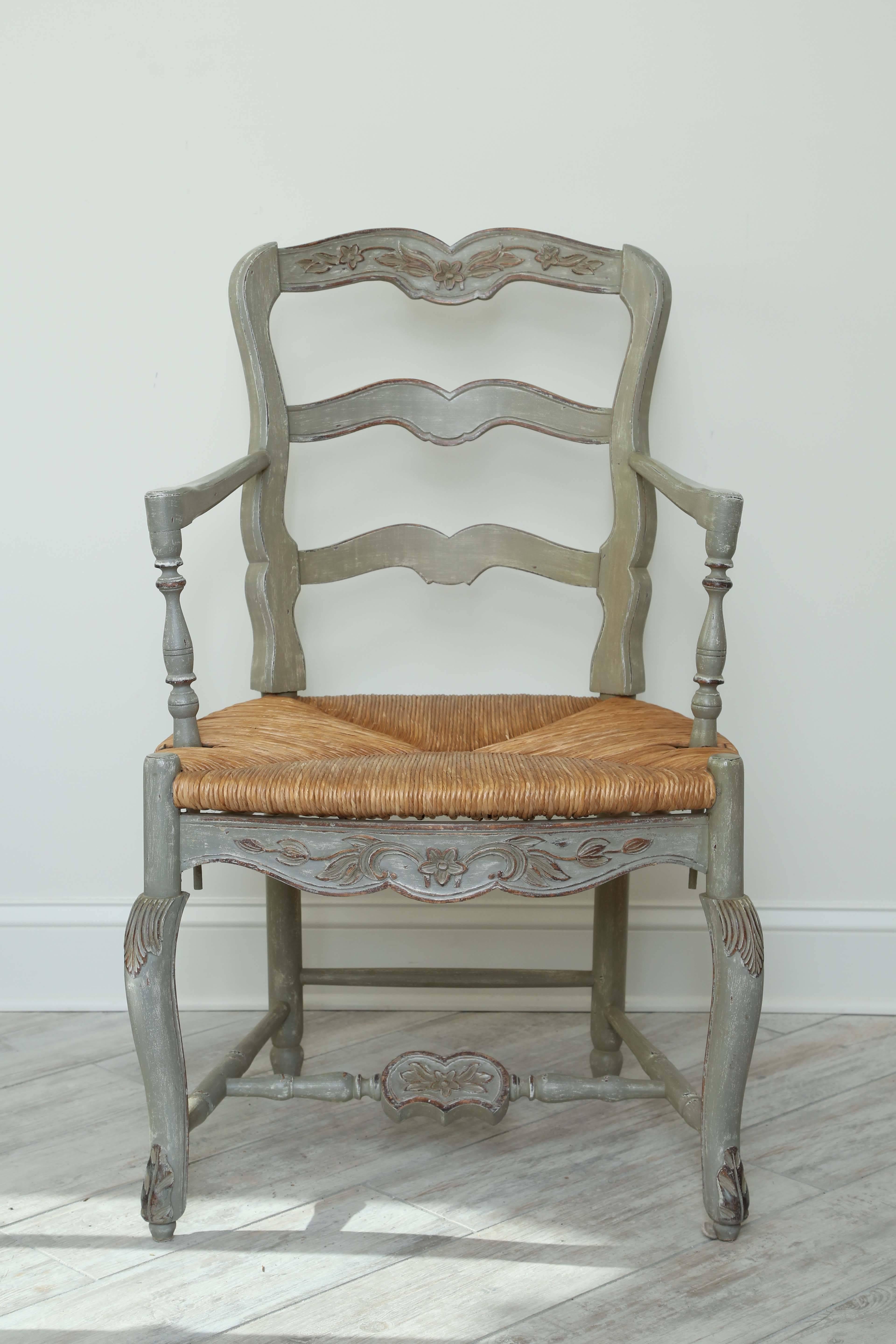 Lovely pair of painted country French armchairs with rush seats.
