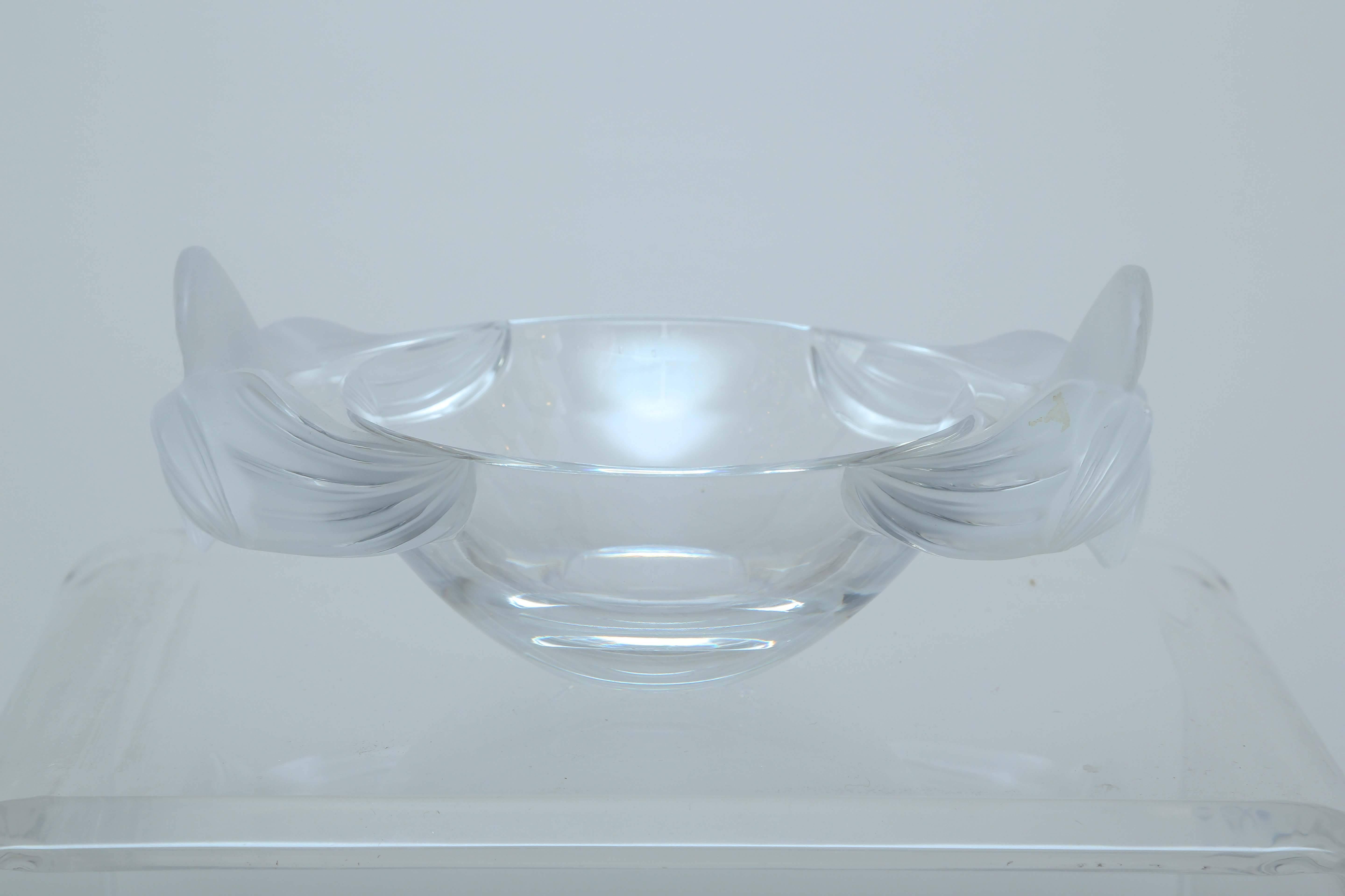 Beautiful rare Lalique centerpiece adorned with orchids on each end. This oval shaped centerpiece bowl has understated elegance.