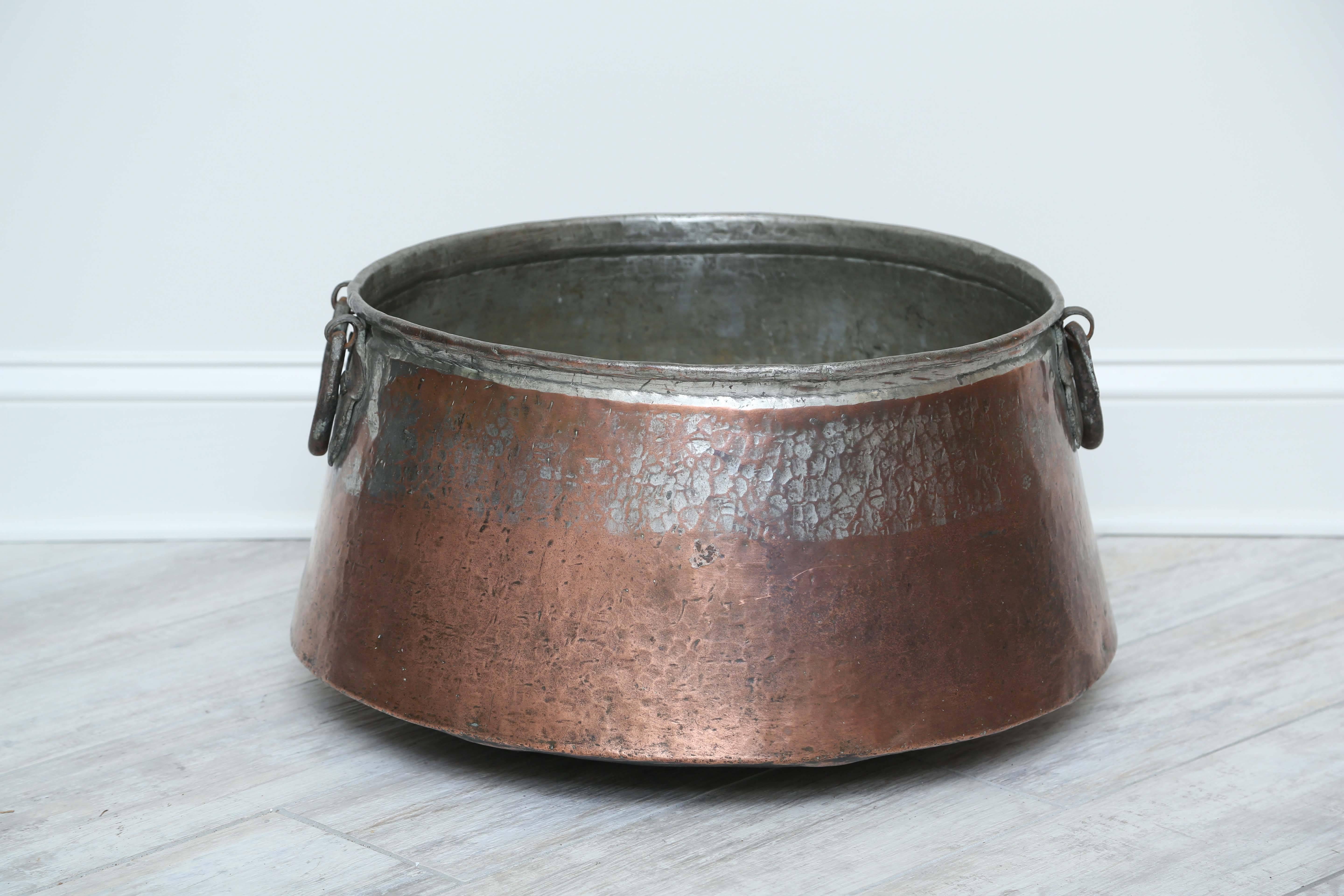 Fabulous large antique copper pot with hand-forged handles.
