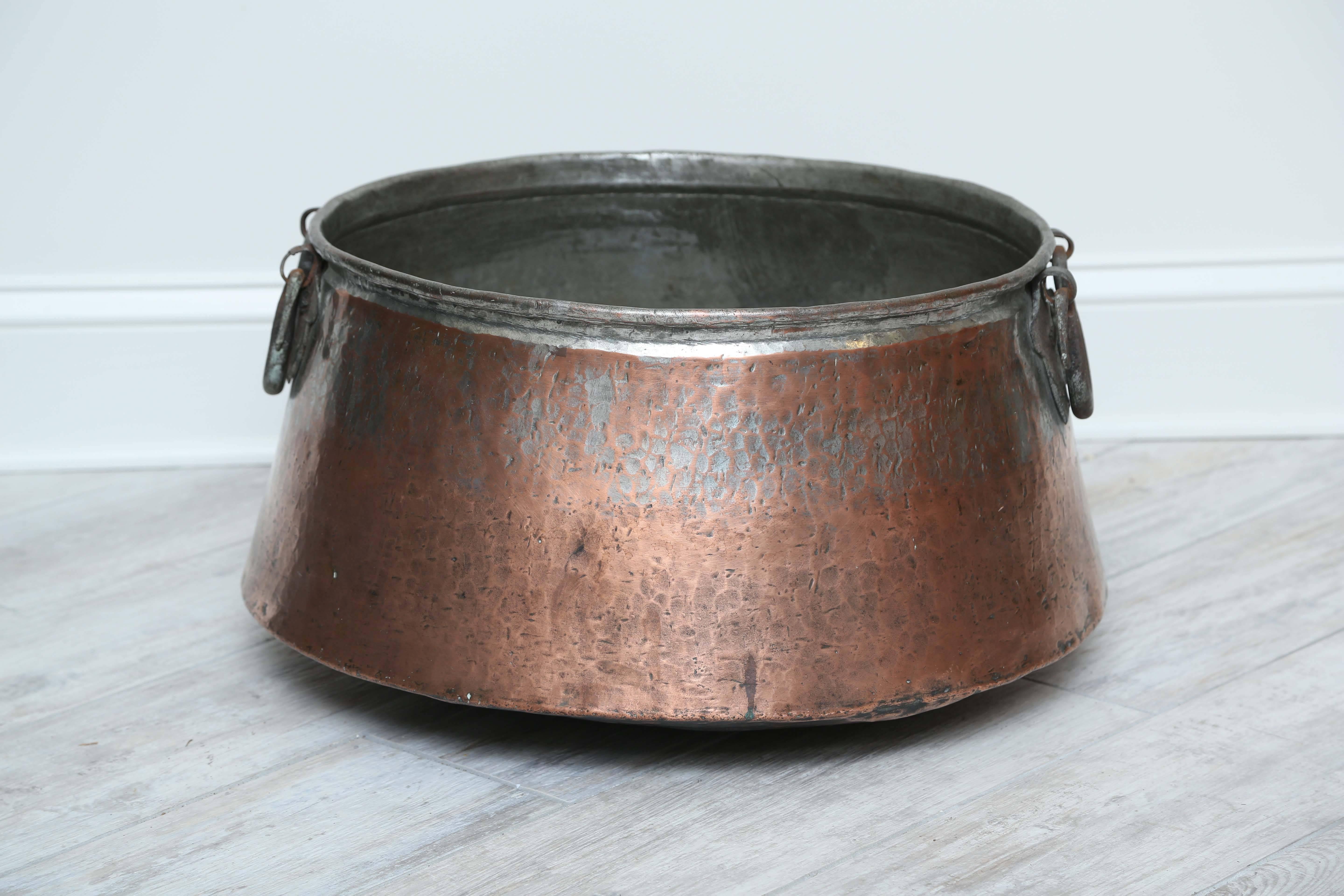 large antique copper cauldron